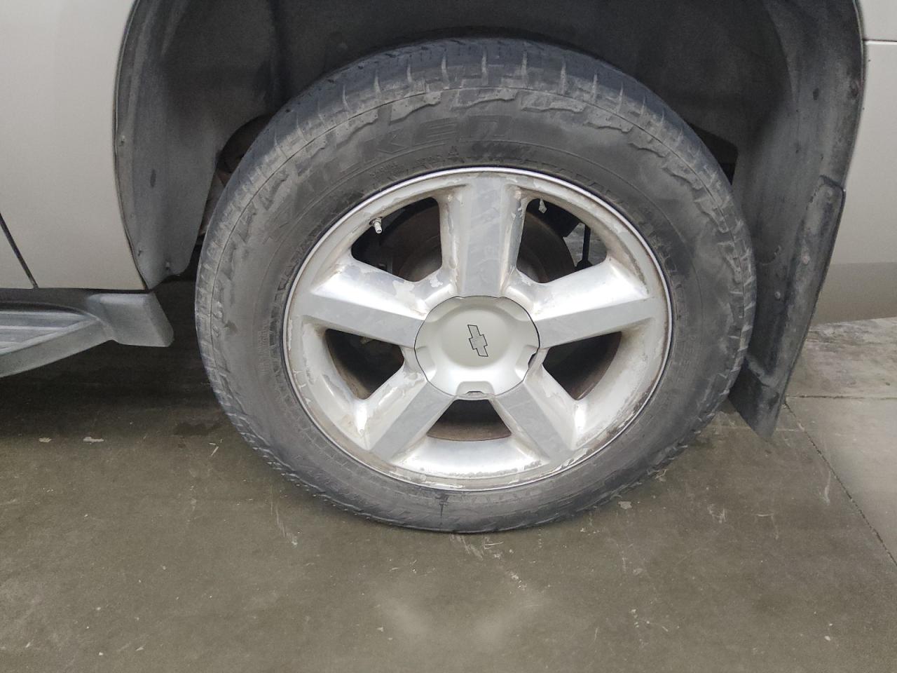 2007 Chevrolet Suburban C1500 Silver vin: 1GNFC16J77J372227 Damage: Left Rear Wheel, Peeling, > 12 Inches