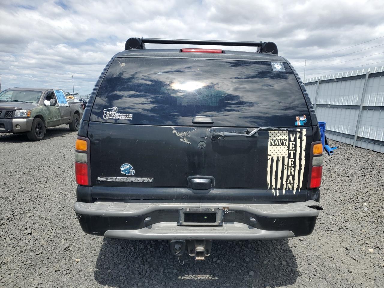 2006 Chevrolet Suburban K1500 Black vin: 1GNFK16ZX6J169176 Damage: Lift Gate, Peeling, > 12 Inches