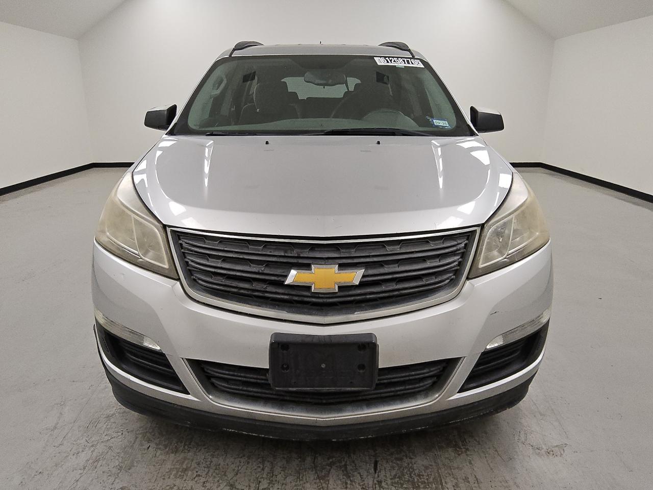 2015 Chevrolet Traverse Ls Silver vin: 1GNKRFEDXFJ344703 Damage: Left Head Lamp, Faded, Acceptable