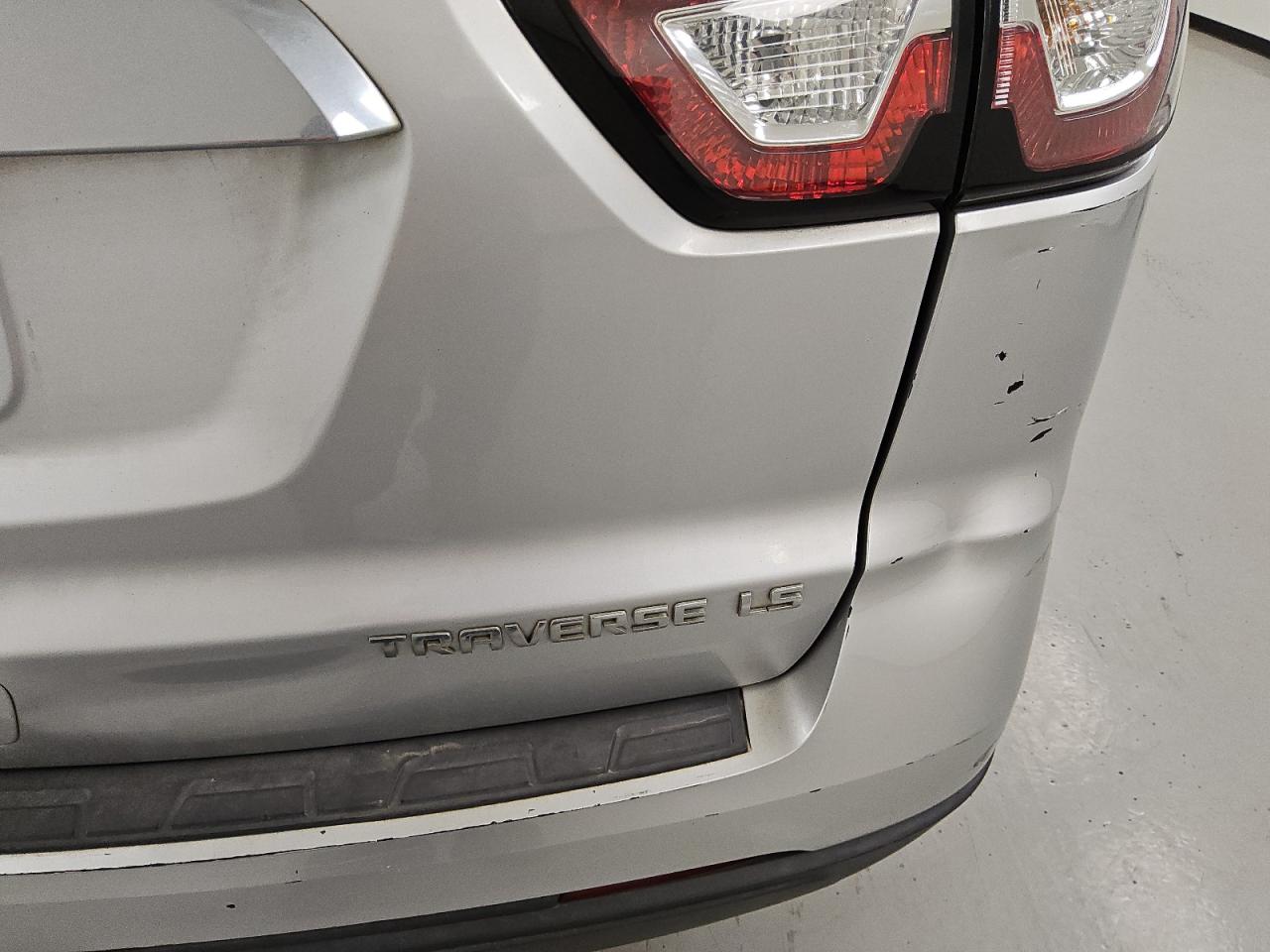 2015 Chevrolet Traverse Ls Silver vin: 1GNKRFEDXFJ344703 Damage: Rear Bumper, Dent(S) W/ Paint Dmg, > 12 Inches