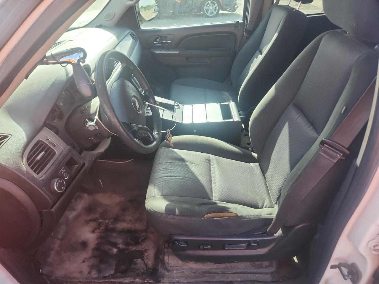 2014 Chevrolet Tahoe Police White vin: 1GNLC2E01ER229287 Damage: Left Front Seat Cushion, Torn, 9 To 10 Inches
