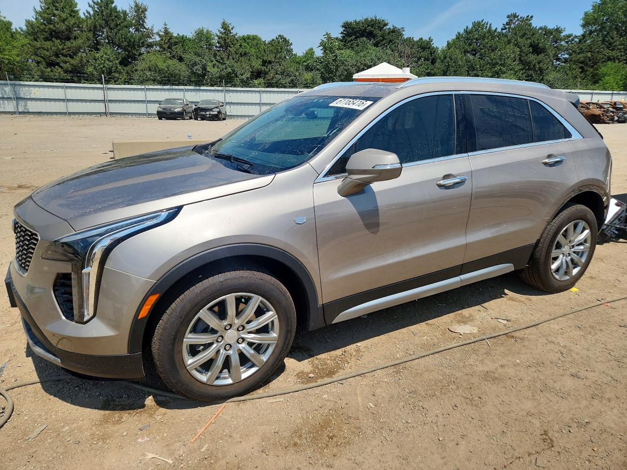 2023 Cadillac Xt4 Premium Luxury Tan vin: 1GYFZDR4XPF143567