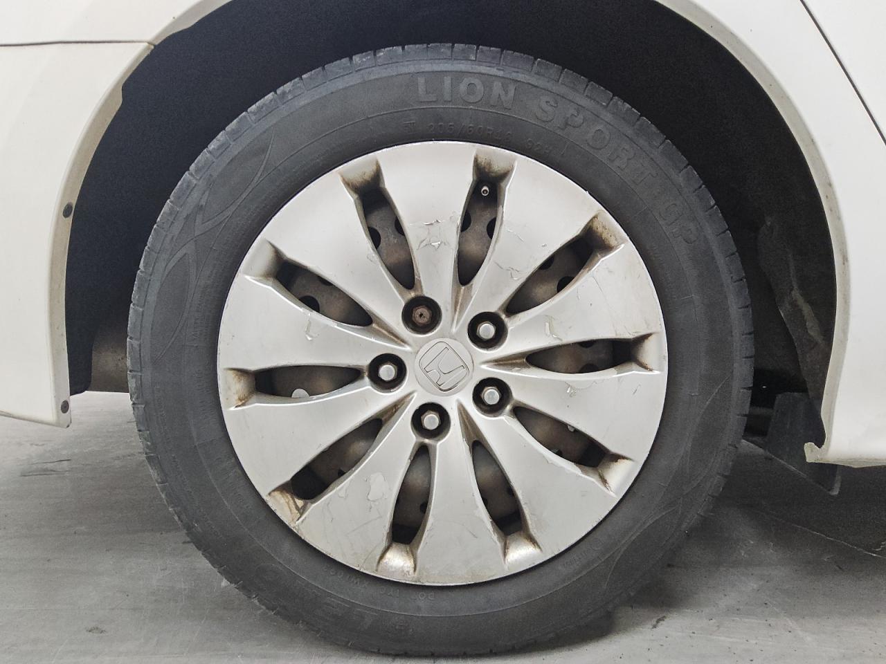 2009 Honda Accord Lx White vin: 1HGCP26369A060797 Damage: Right Rear Wheel Cover, Peeling, > 12 Inches