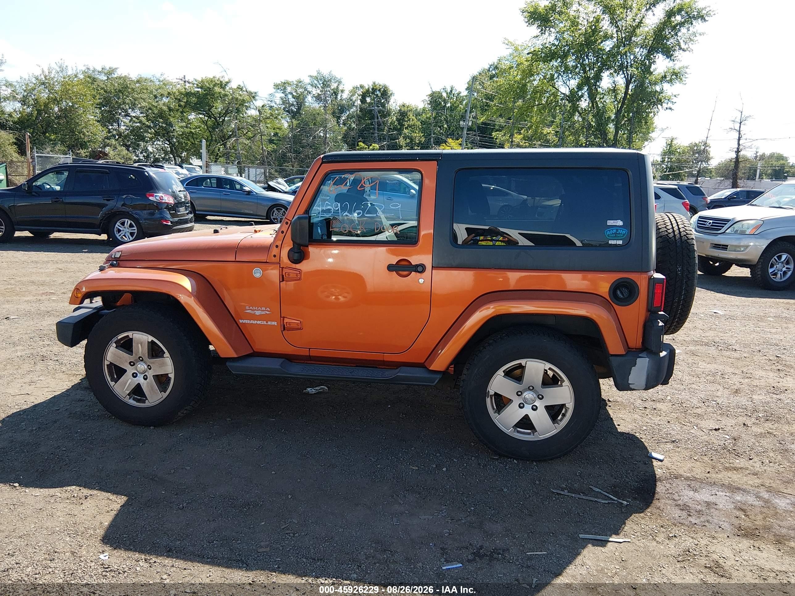 2011 Jeep Wrangler Sahara Orange vin: 1J4AA5D18BL502672