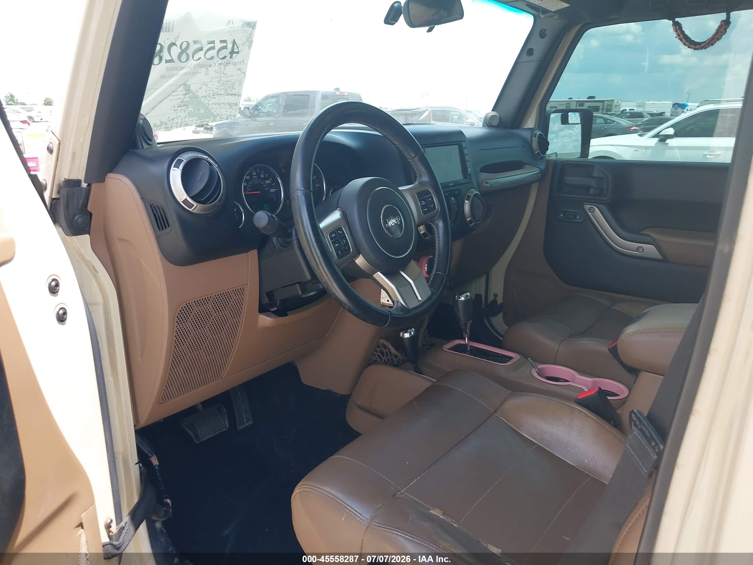2011 Jeep Wrangler Unlimited Sport Tan vin: 1J4BA3H15BL625431