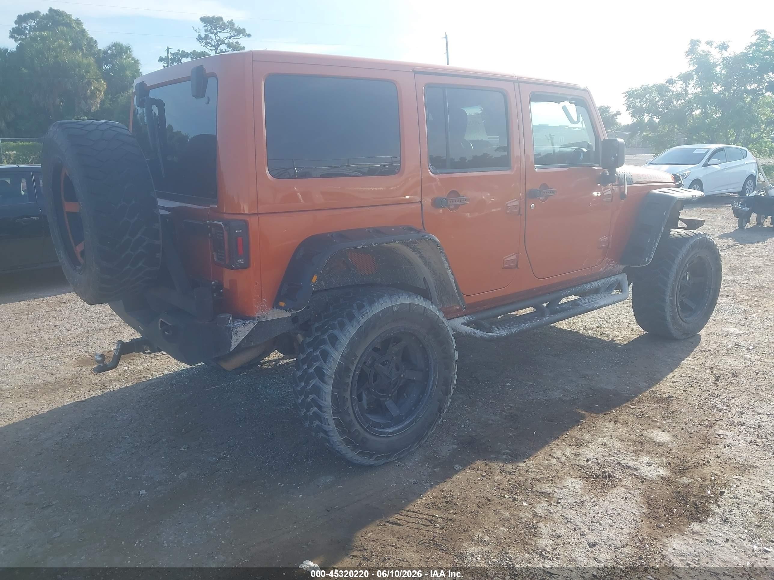 2011 Jeep Wrangler Unlimited Sahara Orange vin: 1J4BA5H15BL632021