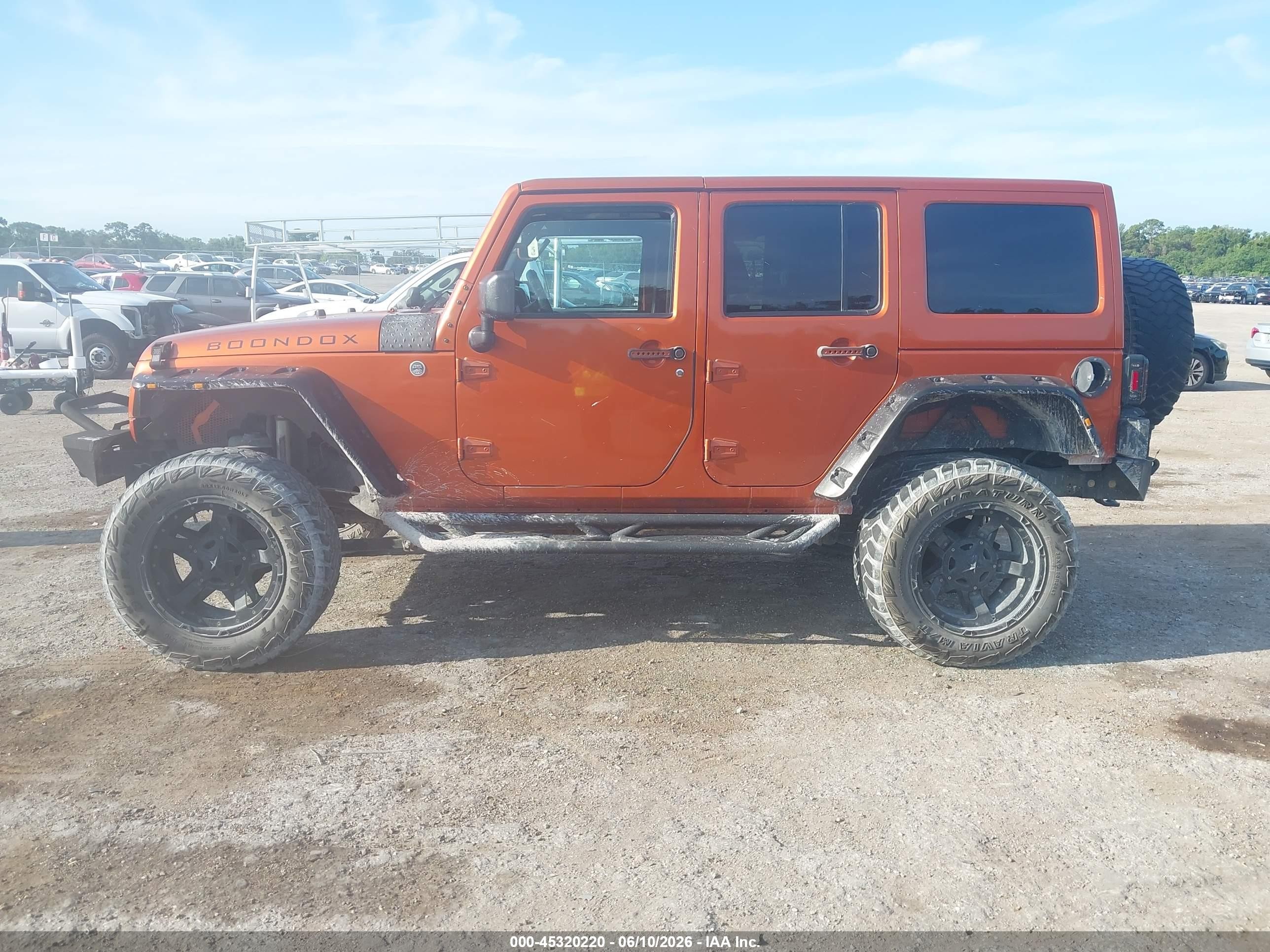 2011 Jeep Wrangler Unlimited Sahara Orange vin: 1J4BA5H15BL632021