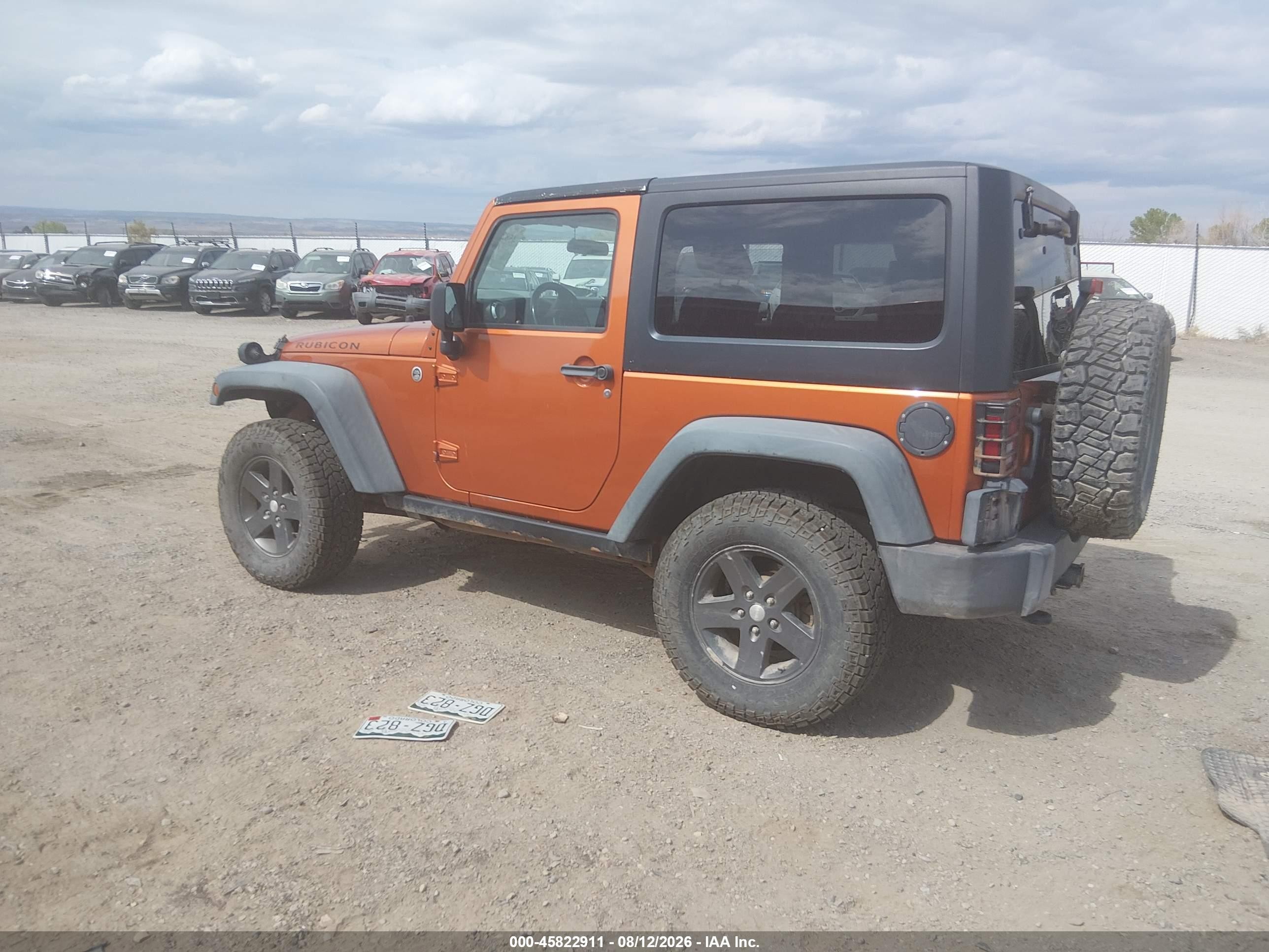 2011 Jeep Wrangler Rubicon Orange vin: 1J4BA6D12BL546192