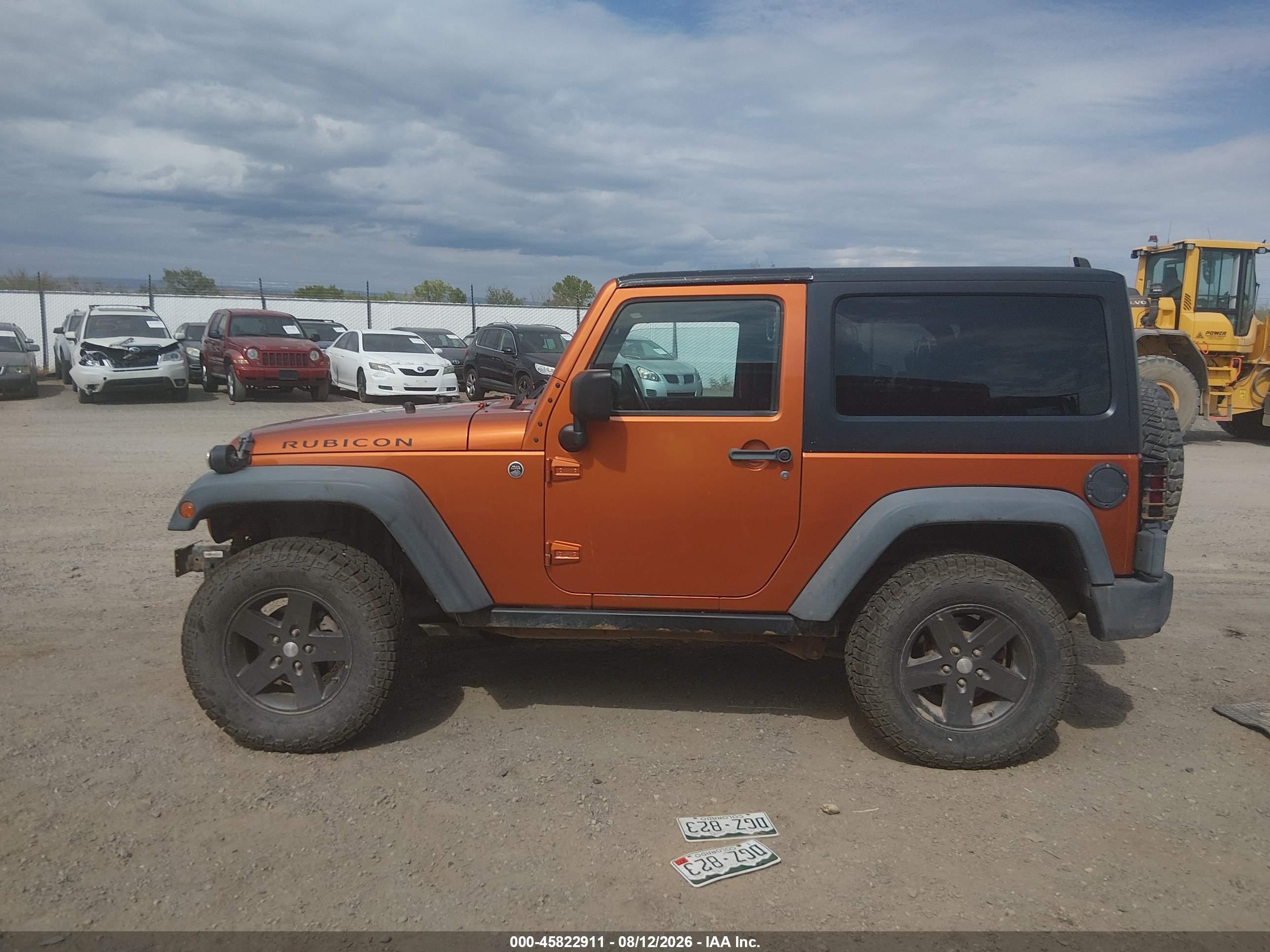 2011 Jeep Wrangler Rubicon Orange vin: 1J4BA6D12BL546192