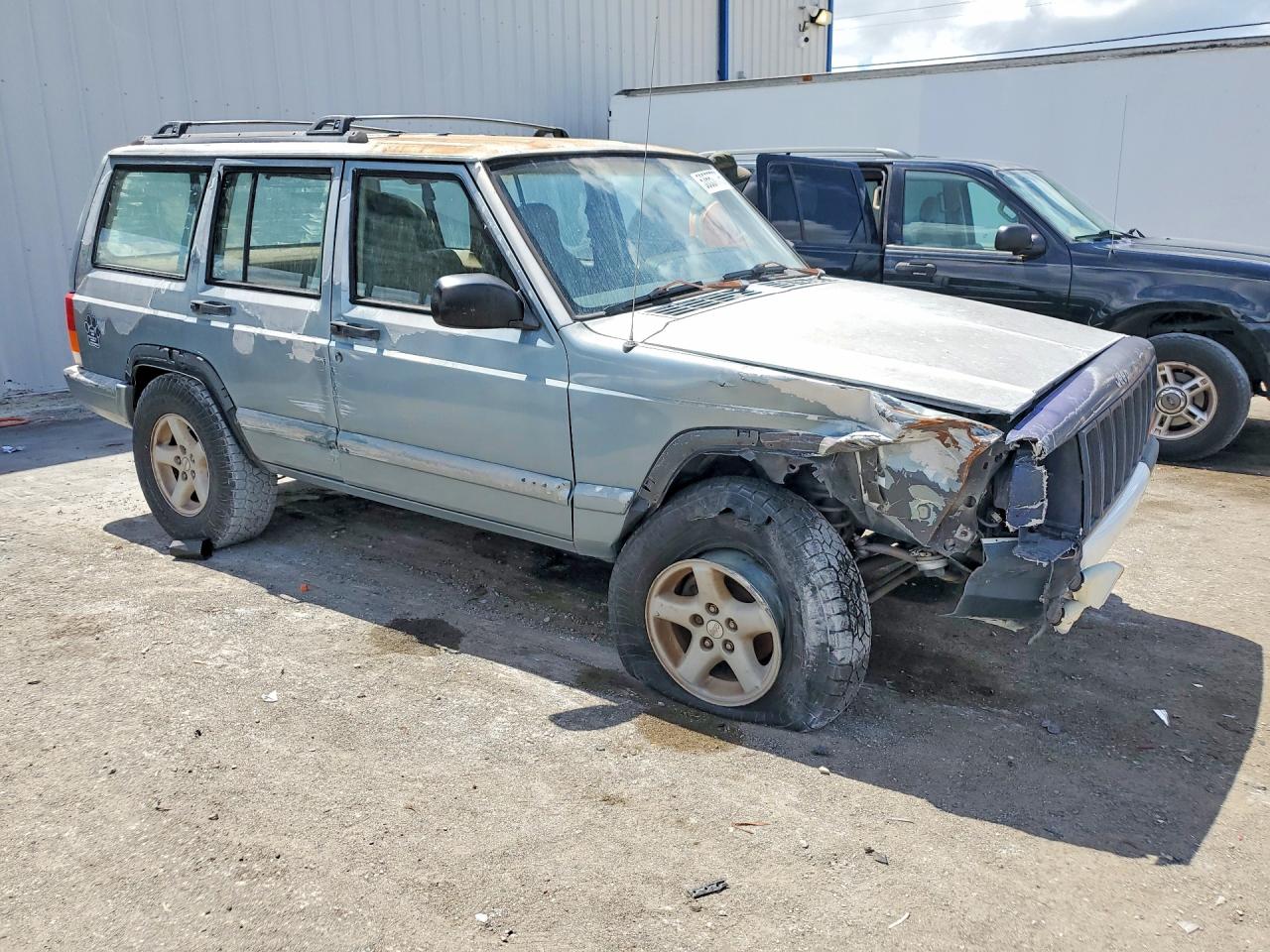 1999 Jeep Cherokee Sport Blue vin: 1J4FT68S9XL604191