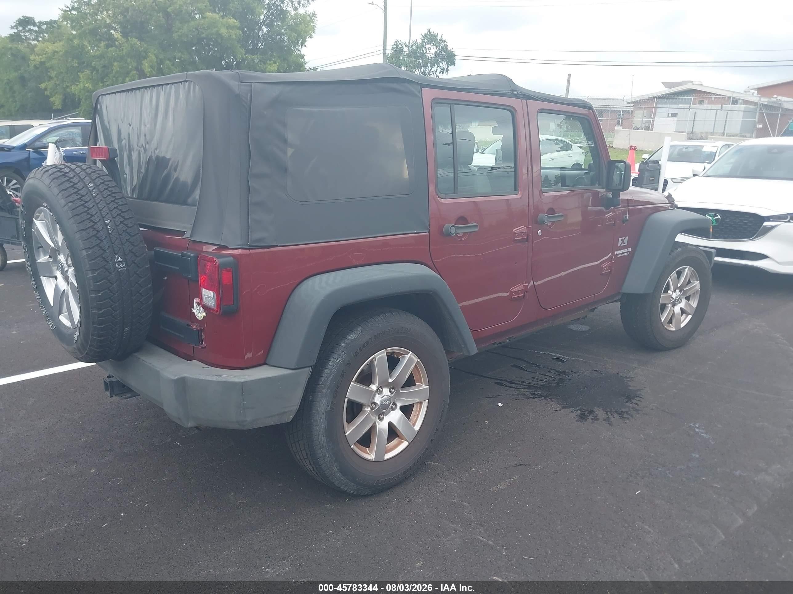 2009 Jeep Wrangler Unlimited X Burgundy vin: 1J4GA39119L759626