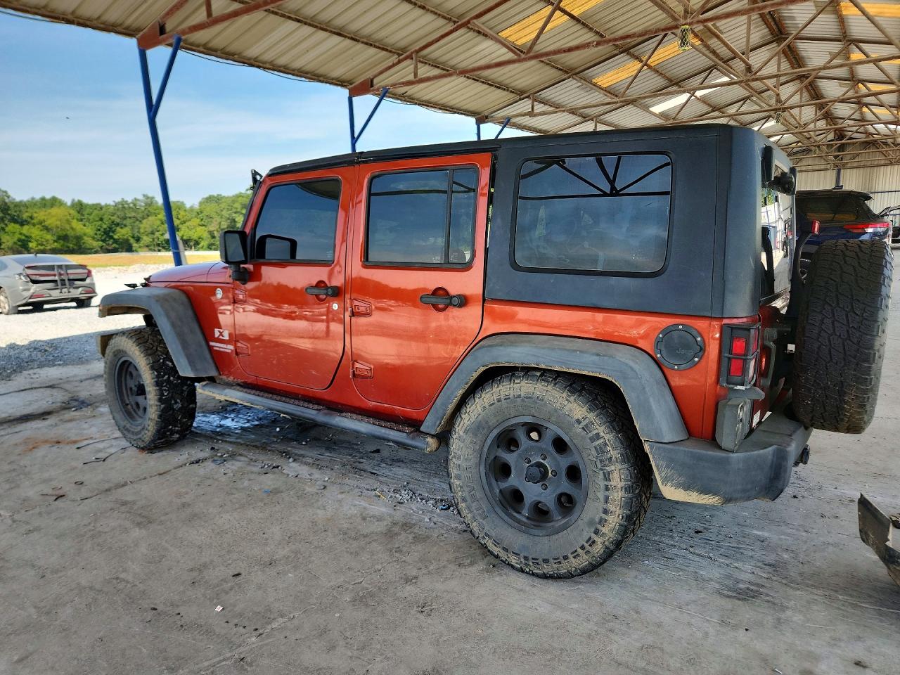 2009 Jeep Wrangler Unlimited X Оранжевый vin: 1J4GA39129L770876