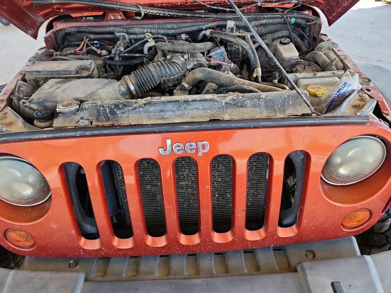 2009 Jeep Wrangler Unlimited X Оранжевый vin: 1J4GA39129L770876