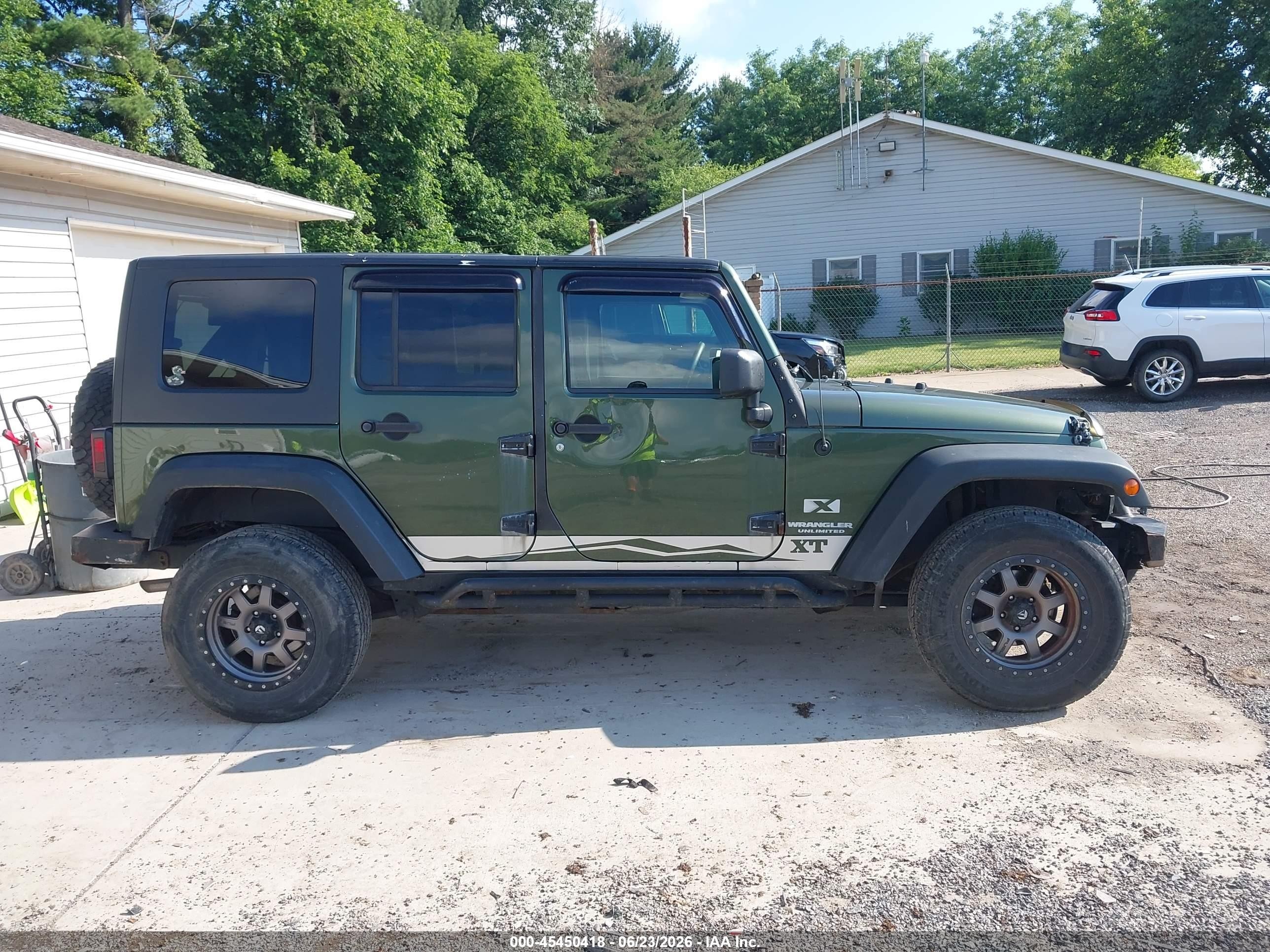 2009 Jeep Wrangler Unlimited X Green vin: 1J4GA39149L711196