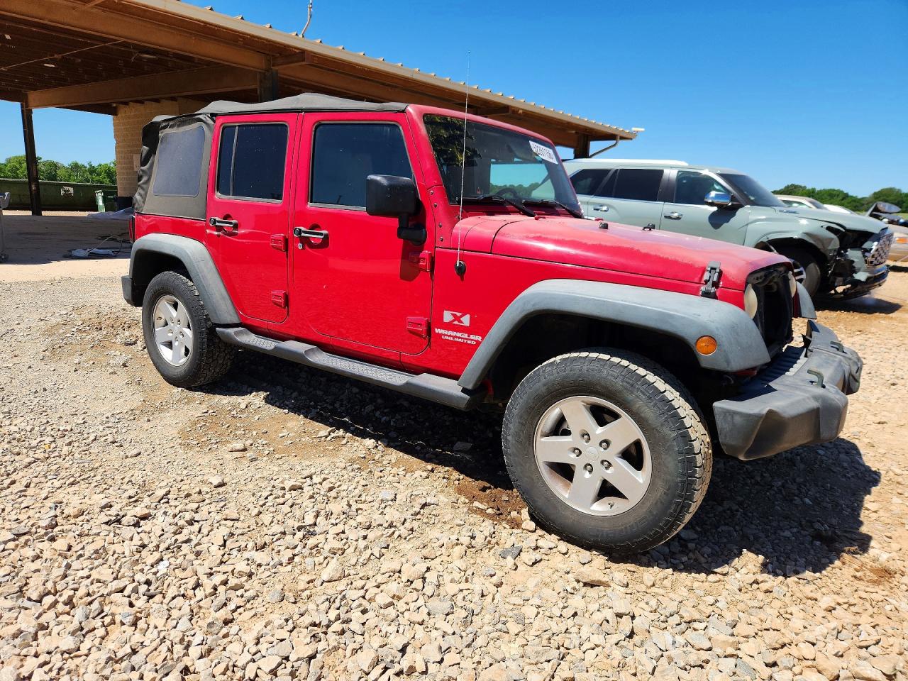 2009 Jeep Wrangler Unlimited X Red vin: 1J4GA39179L704033