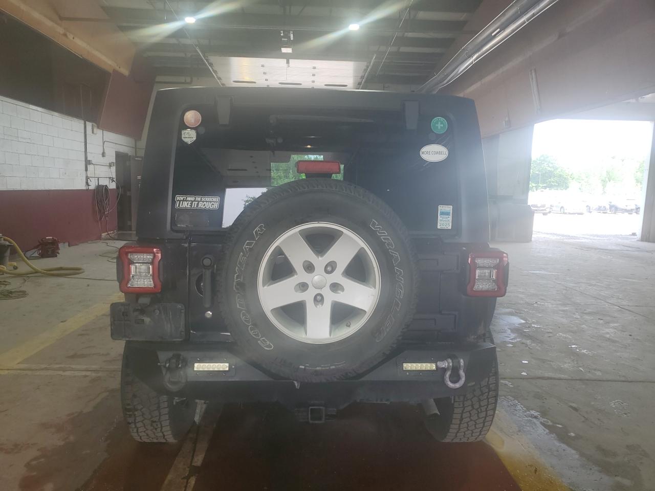 2009 Jeep Wrangler Unlimited X Black vin: 1J4GA39189L790677 Damage: Rear Bumper, Aftermarket, Acceptable
