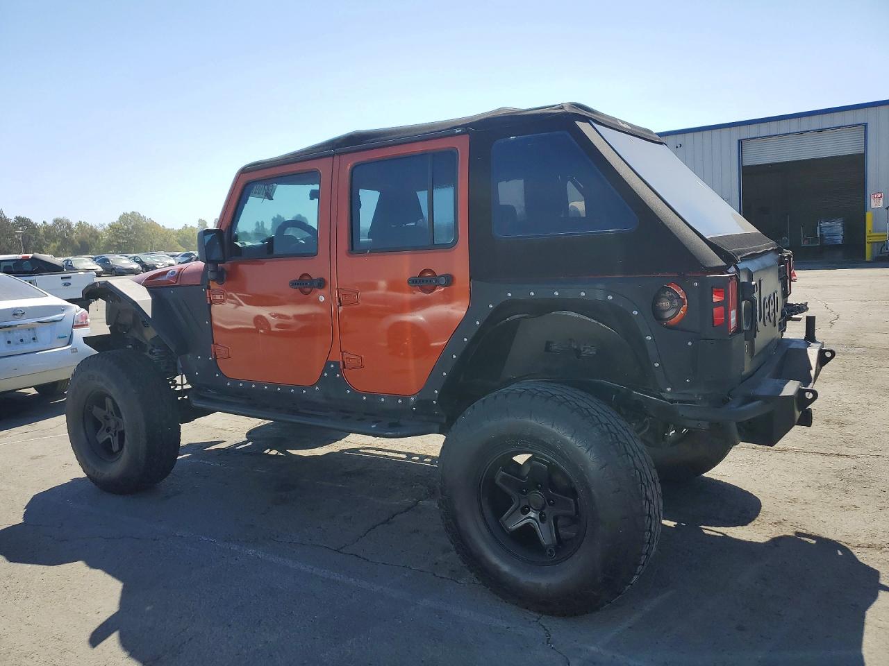 2009 Jeep Wrangler Unlimited X Orange vin: 1J4GA391X9L772259