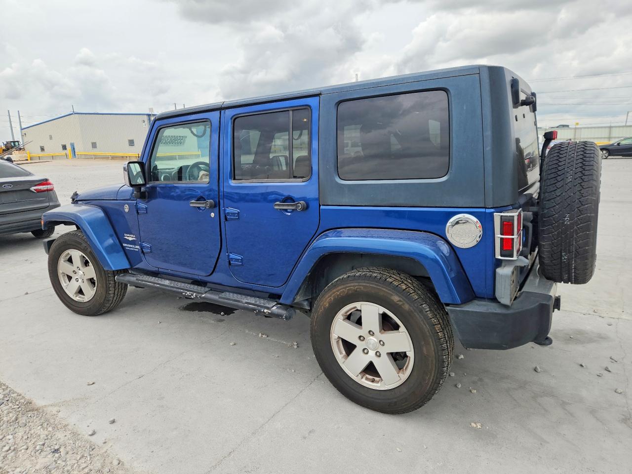 2009 Jeep Wrangler Unlimited Sahara Blue vin: 1J4GA59139L769702