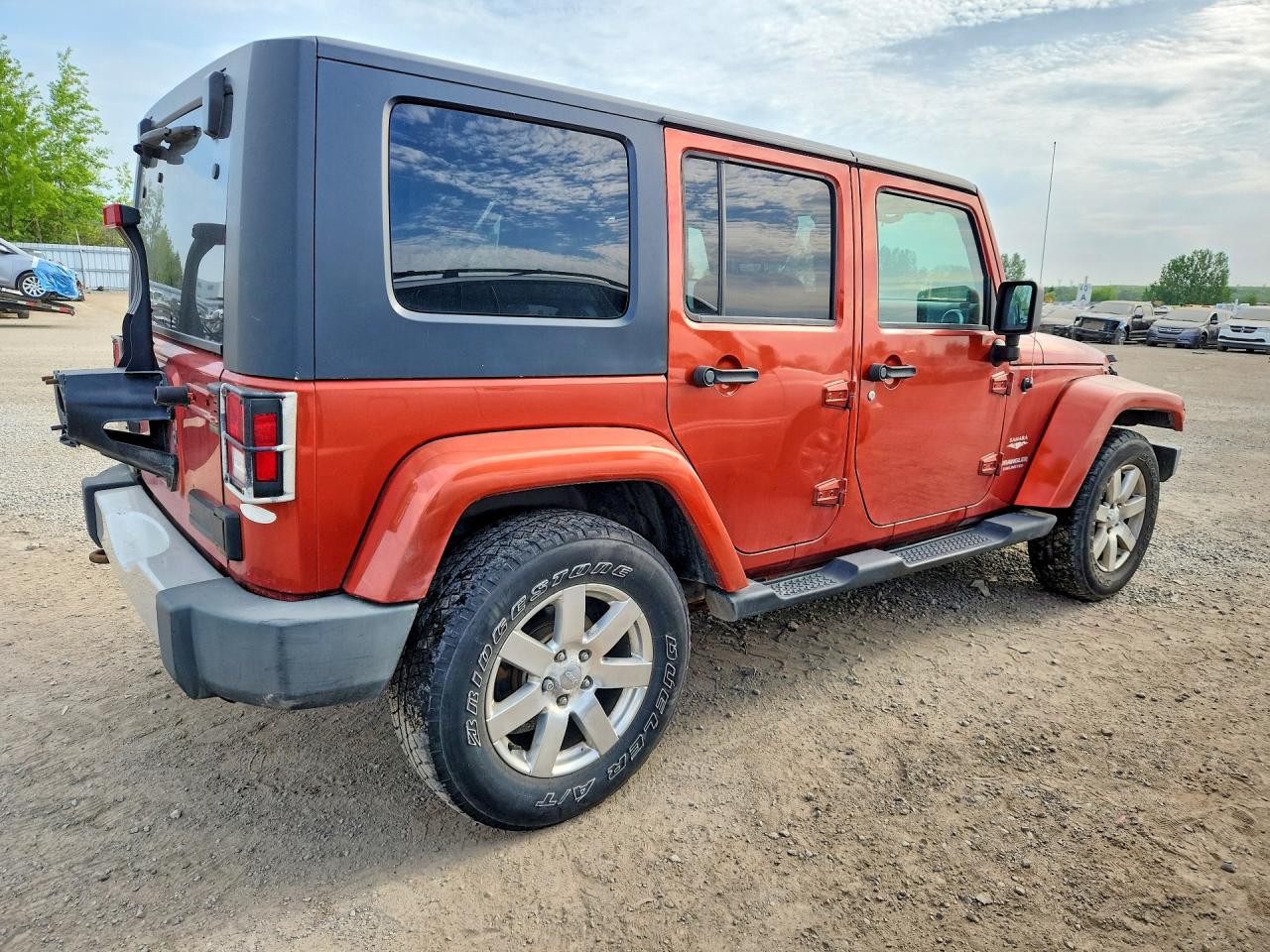 2009 Jeep Wrangler Unlimited Sahara Оранжевый vin: 1J4GA59149L731962