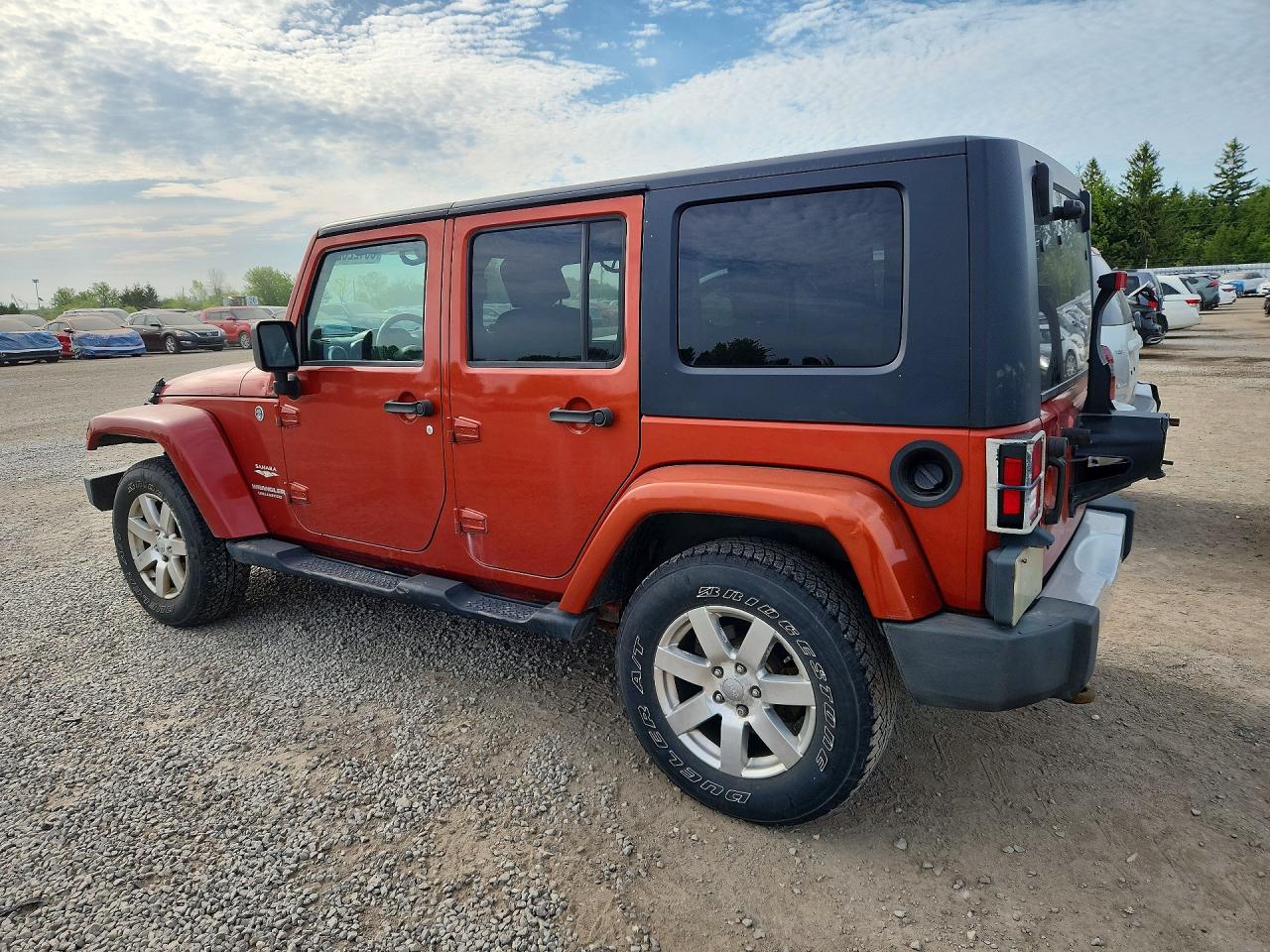 2009 Jeep Wrangler Unlimited Sahara Оранжевый vin: 1J4GA59149L731962