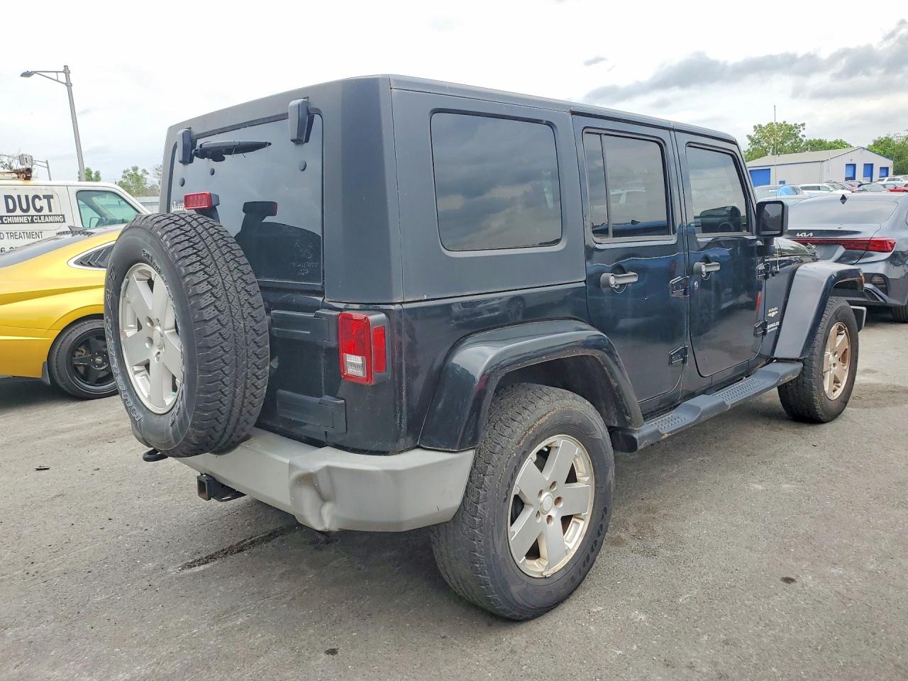 2009 Jeep Wrangler Unlimited Sahara Black vin: 1J4GA59149L775542