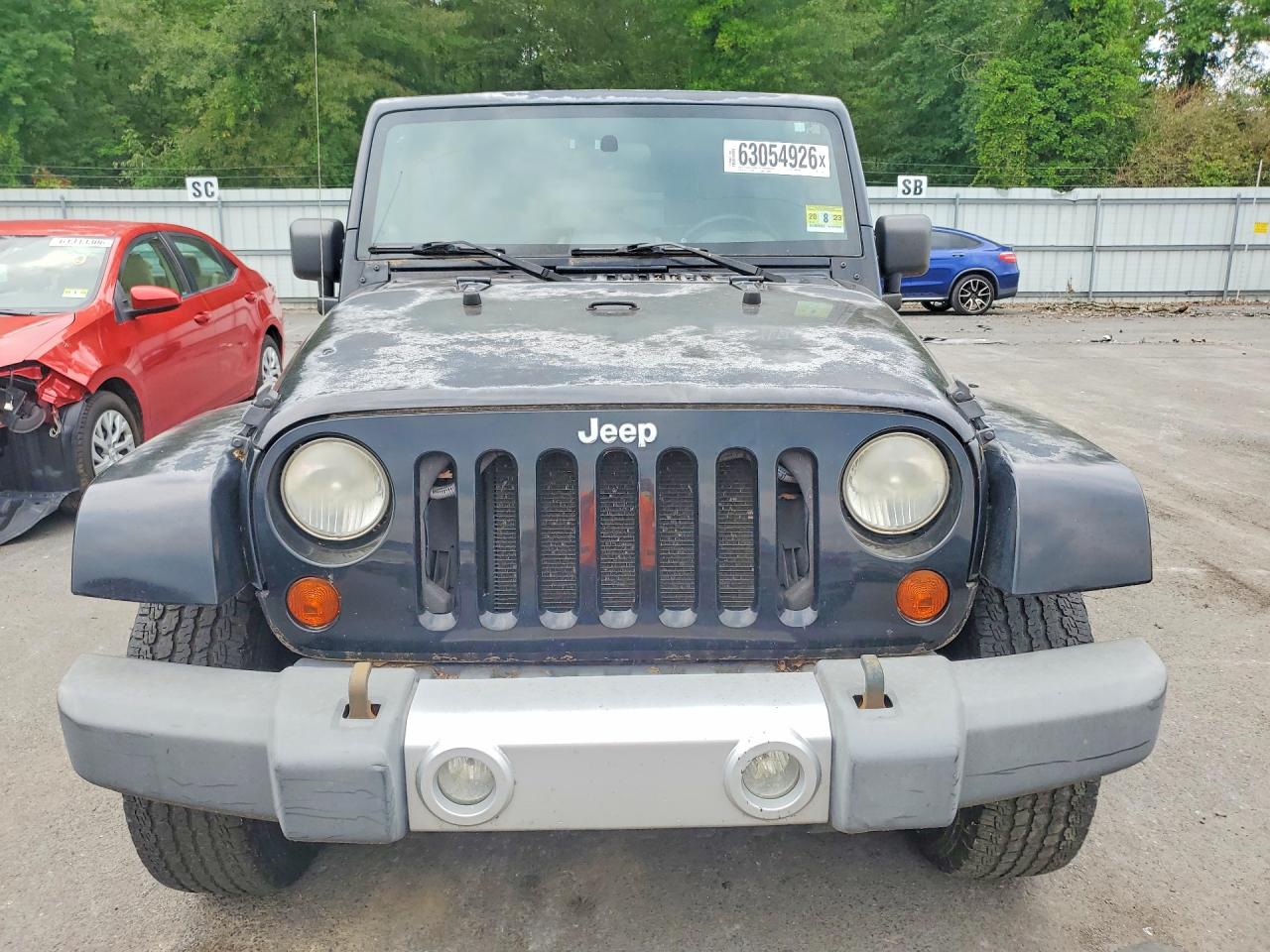 2009 Jeep Wrangler Unlimited Sahara Black vin: 1J4GA59149L775542