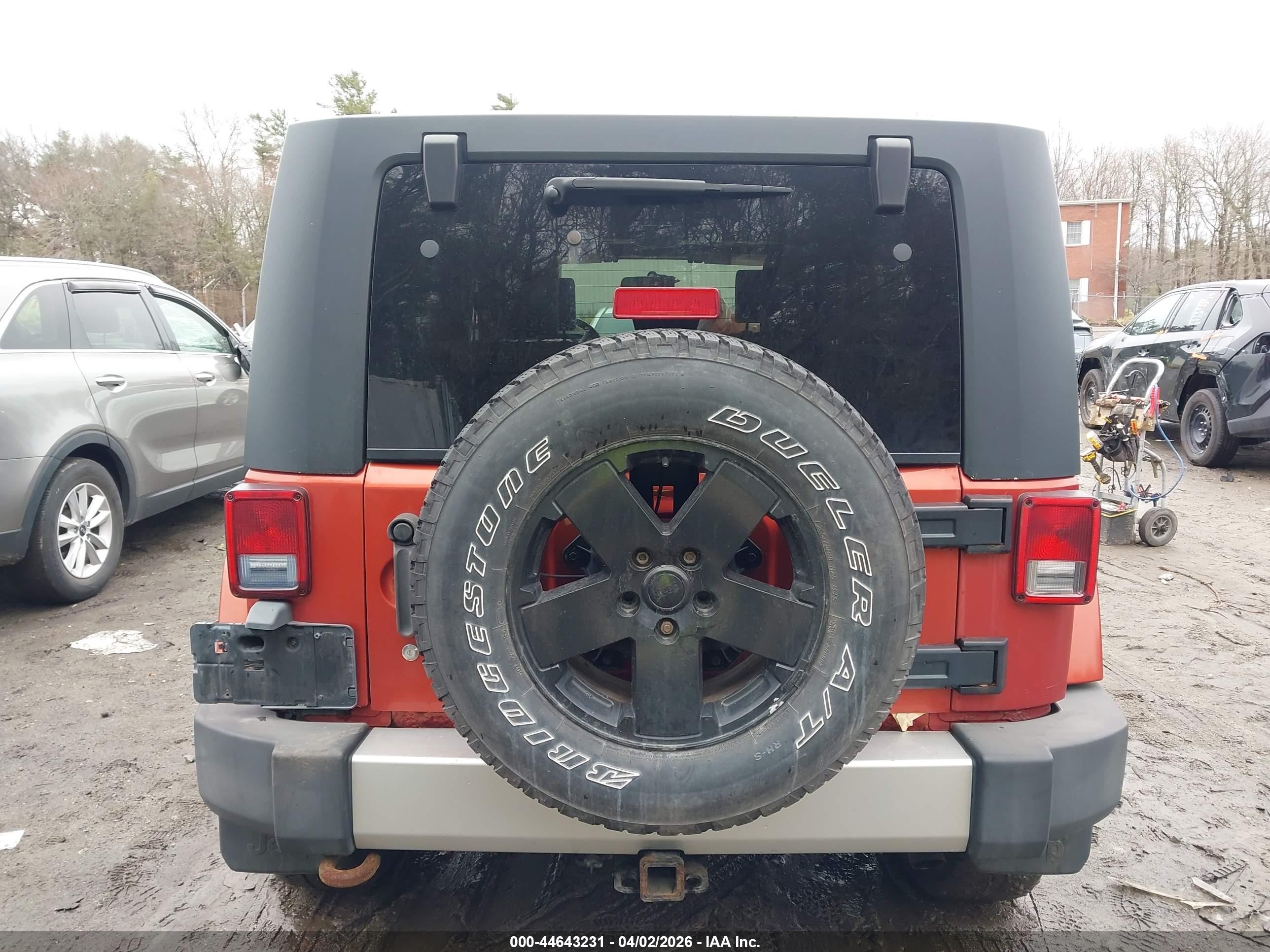 2009 Jeep Wrangler Unlimited Sahara Orange vin: 1J4GA59179L708823