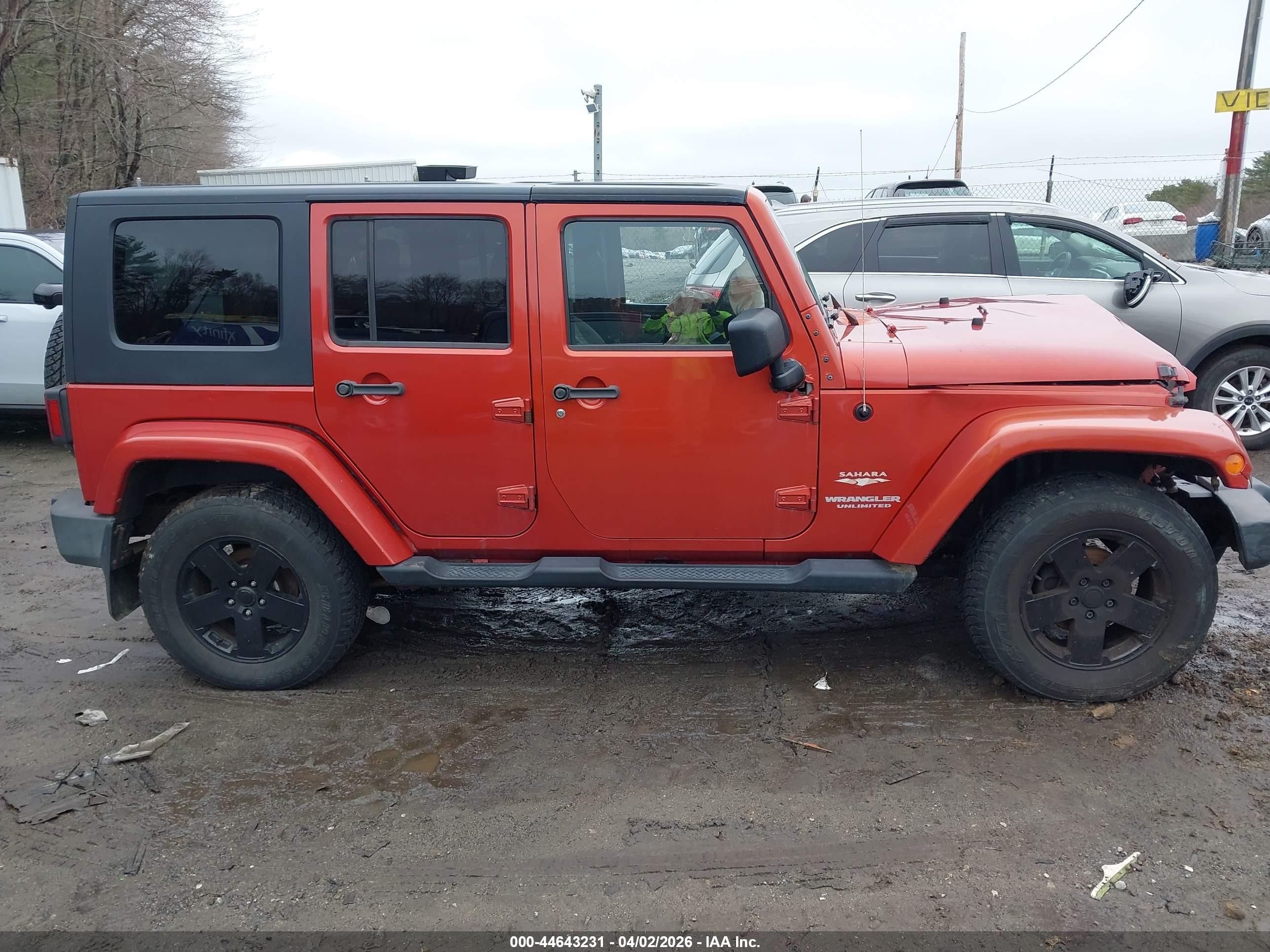 2009 Jeep Wrangler Unlimited Sahara Orange vin: 1J4GA59179L708823