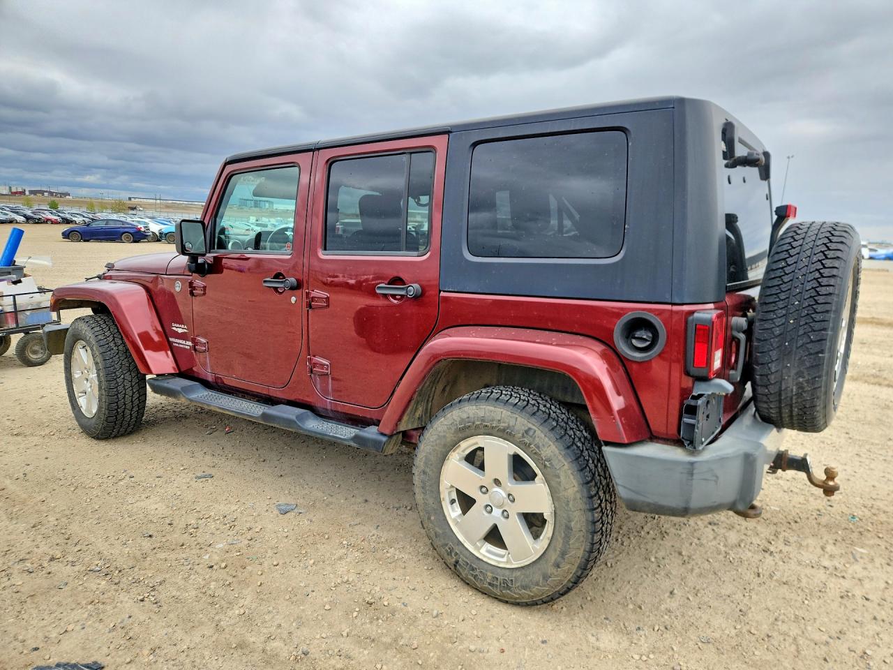 2009 Jeep Wrangler Unlimited Sahara Maroon vin: 1J4GA59189L747937
