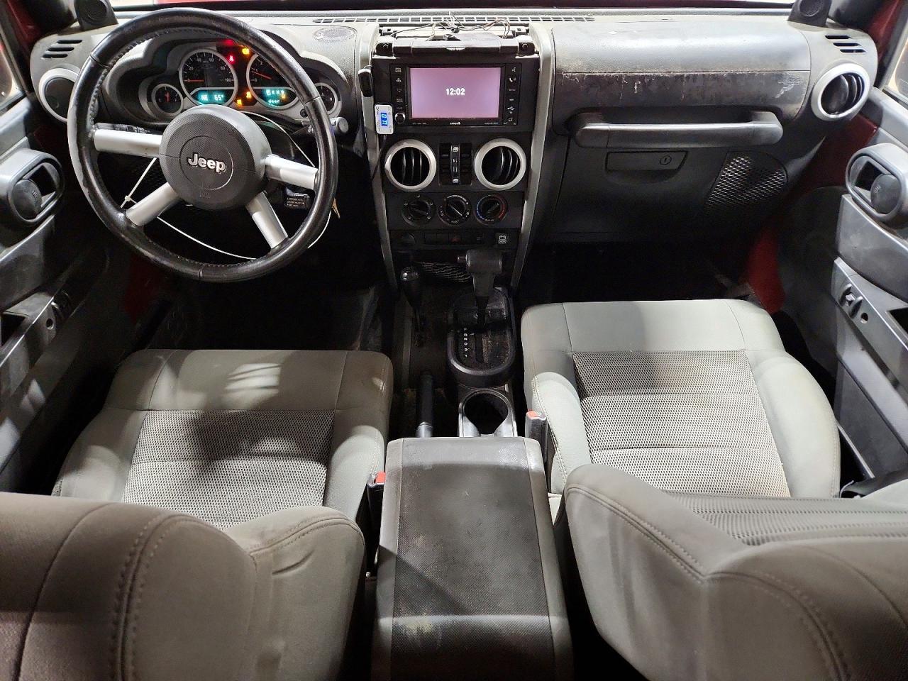 2009 Jeep Wrangler Unlimited Sahara Burgundy vin: 1J4GA591X9L759460
