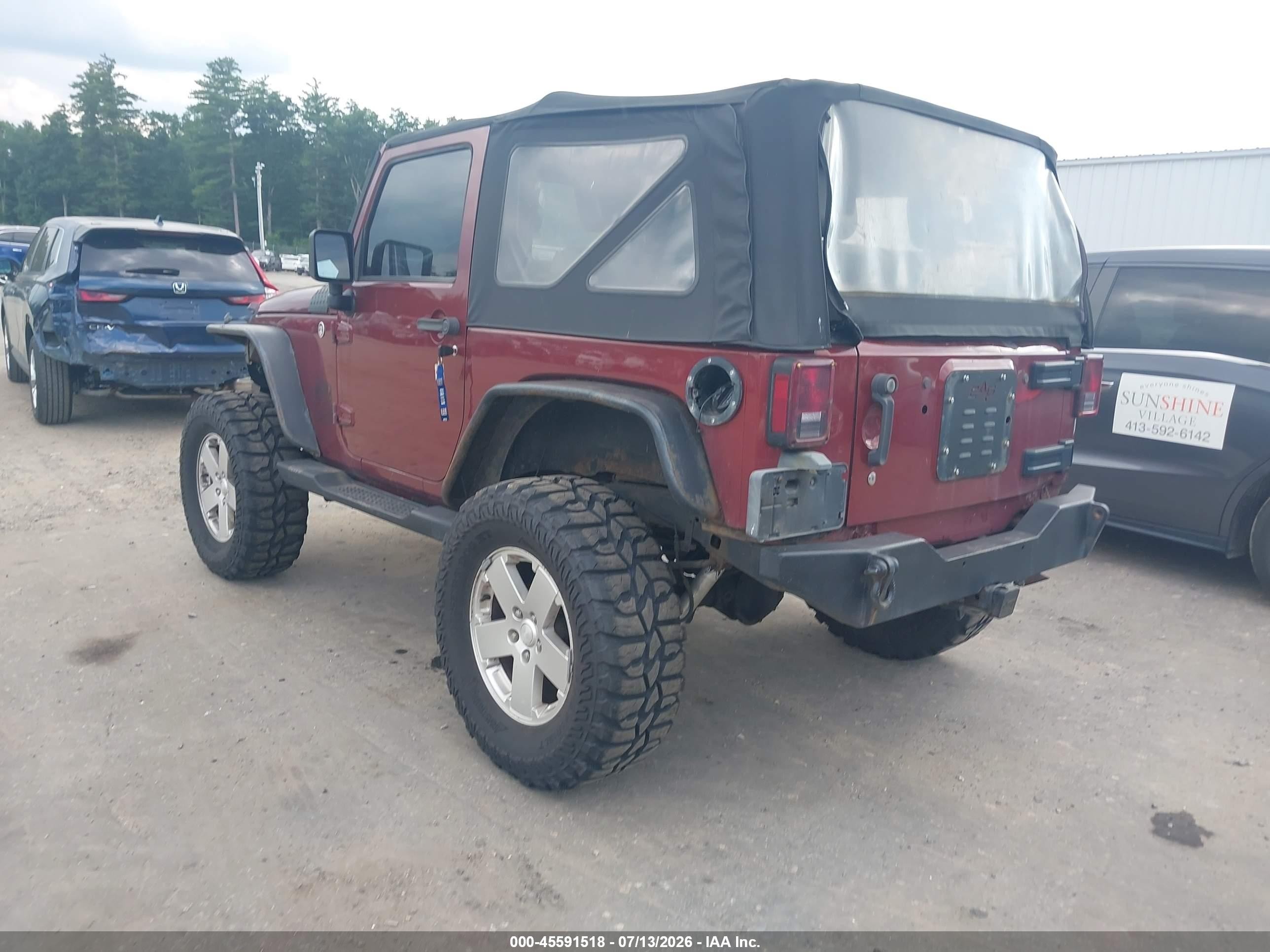 2010 Jeep Wrangler Sahara Red vin: 1J4GA5D19AL140537