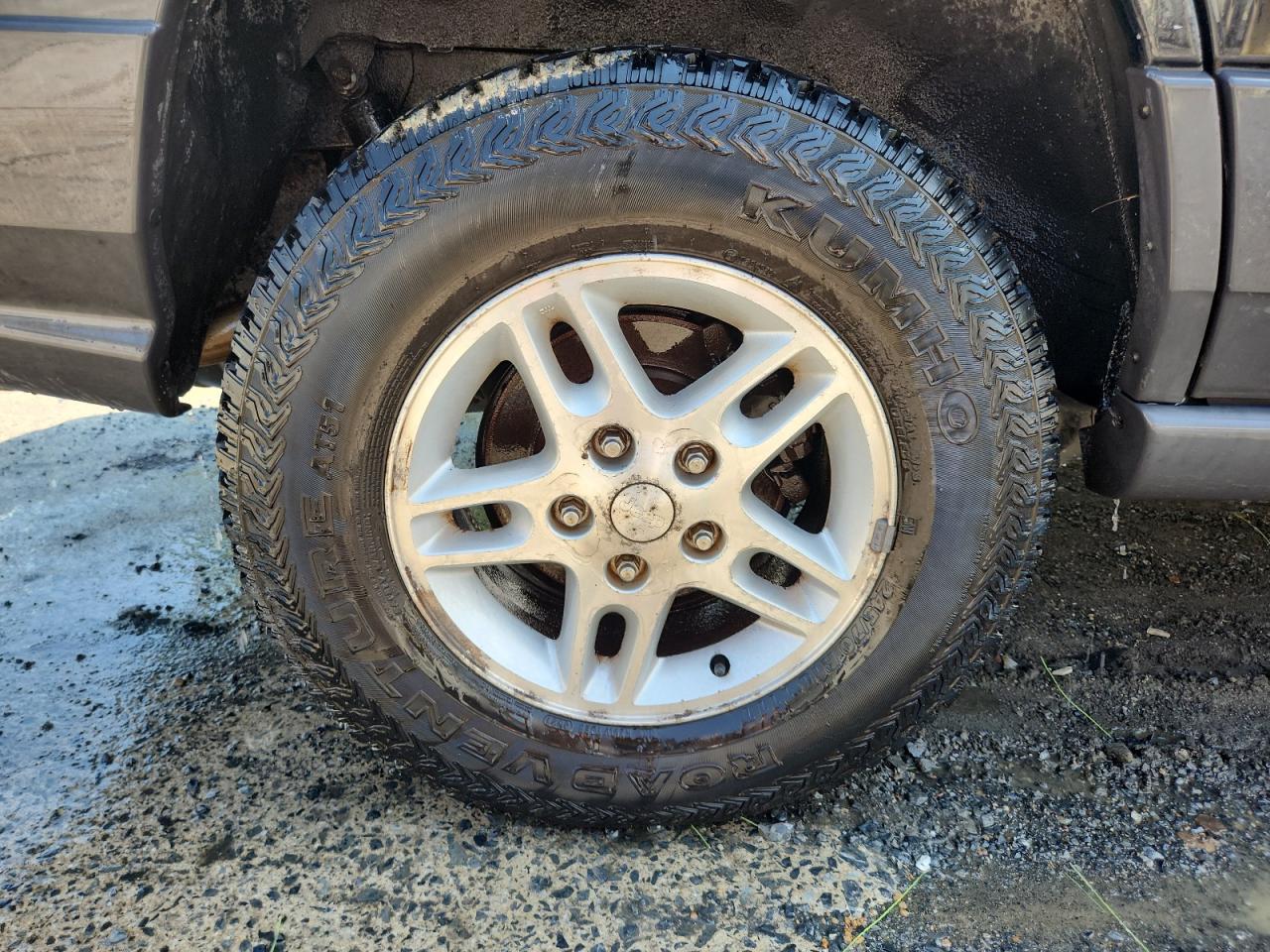 2004 Jeep Grand Cherokee Laredo Black vin: 1J4GW48S84C312866 Damage: Right Rear Wheel, Corrosion, > 12 Inches