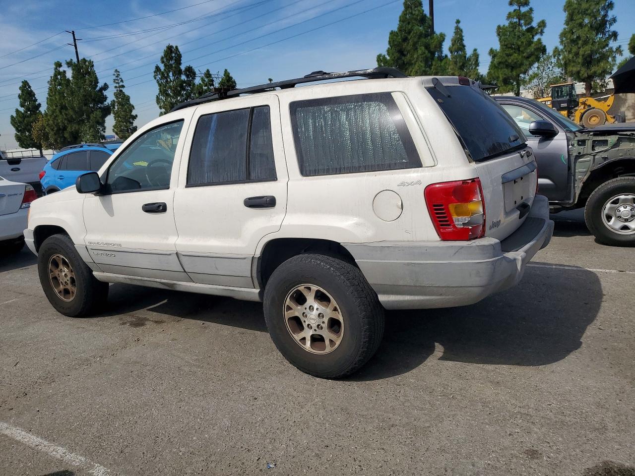 1999 Jeep Grand Cherokee Laredo Белый vin: 1J4GW58S3XC589239