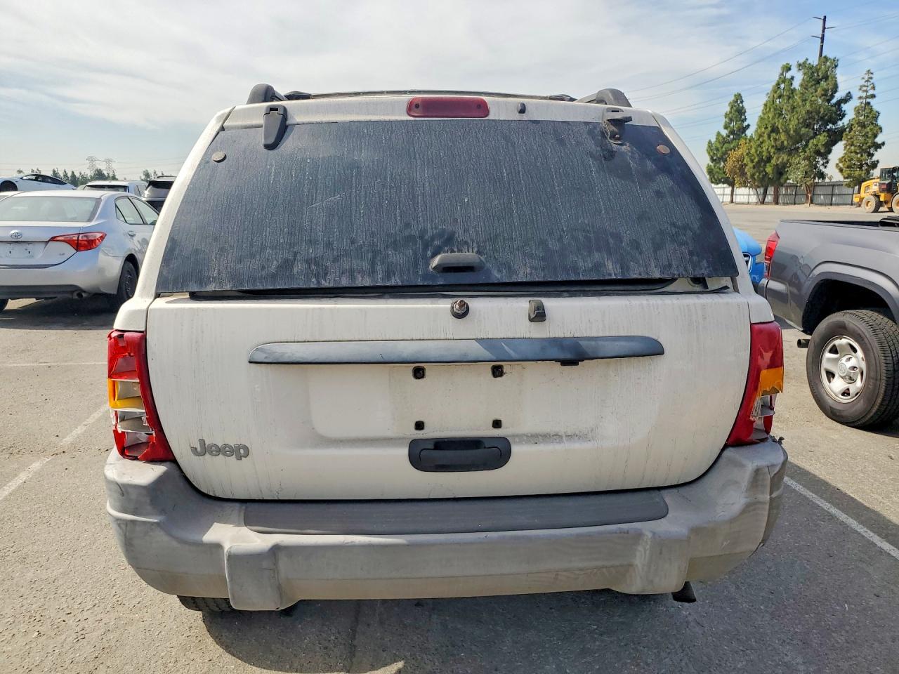1999 Jeep Grand Cherokee Laredo Белый vin: 1J4GW58S3XC589239