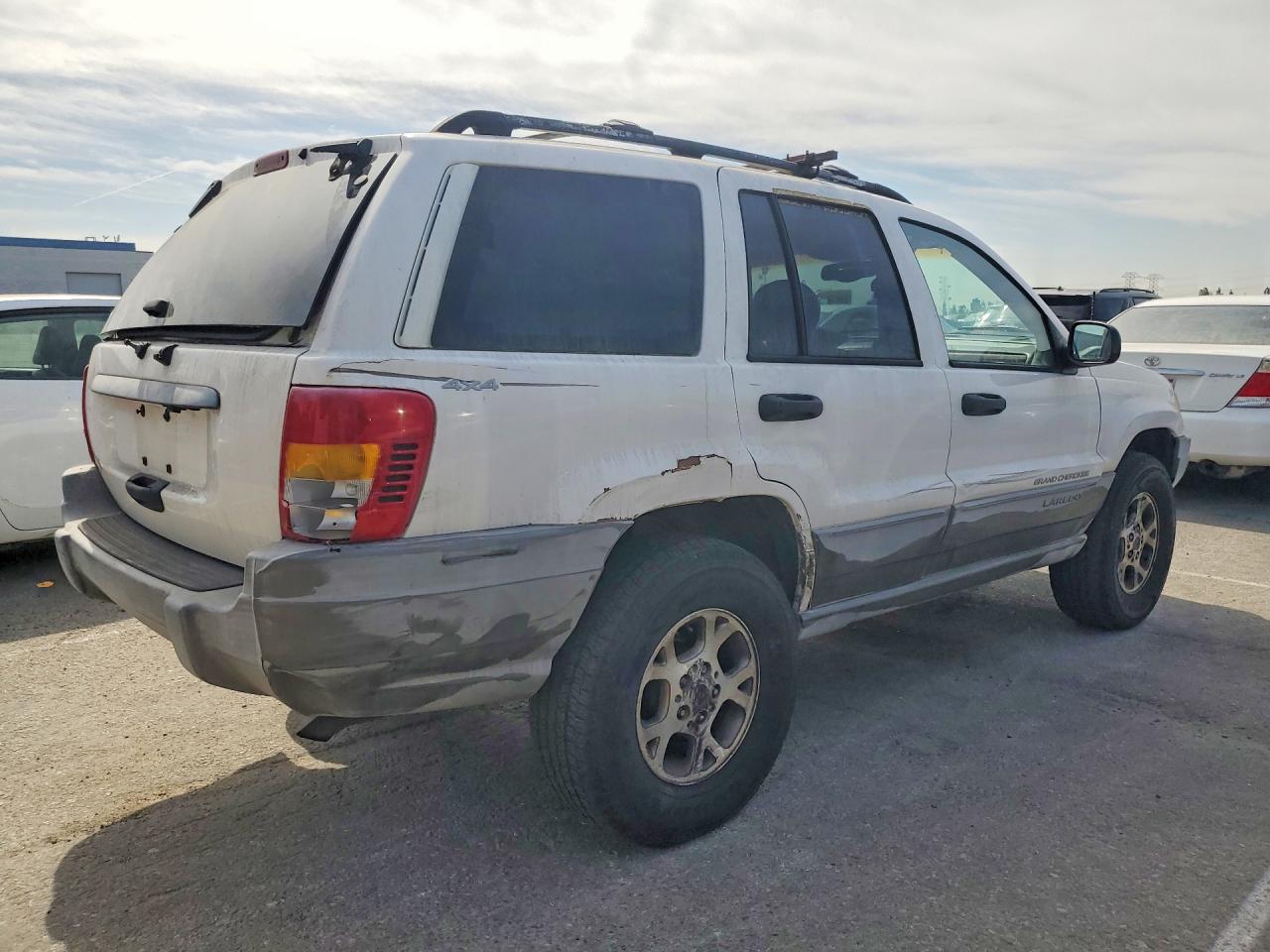 1999 Jeep Grand Cherokee Laredo Белый vin: 1J4GW58S3XC589239