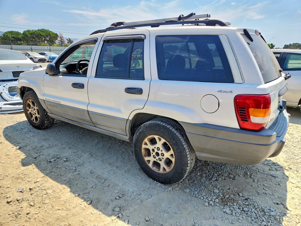 1999 Jeep Grand Cherokee Laredo Белый vin: 1J4GW58S9XC682248