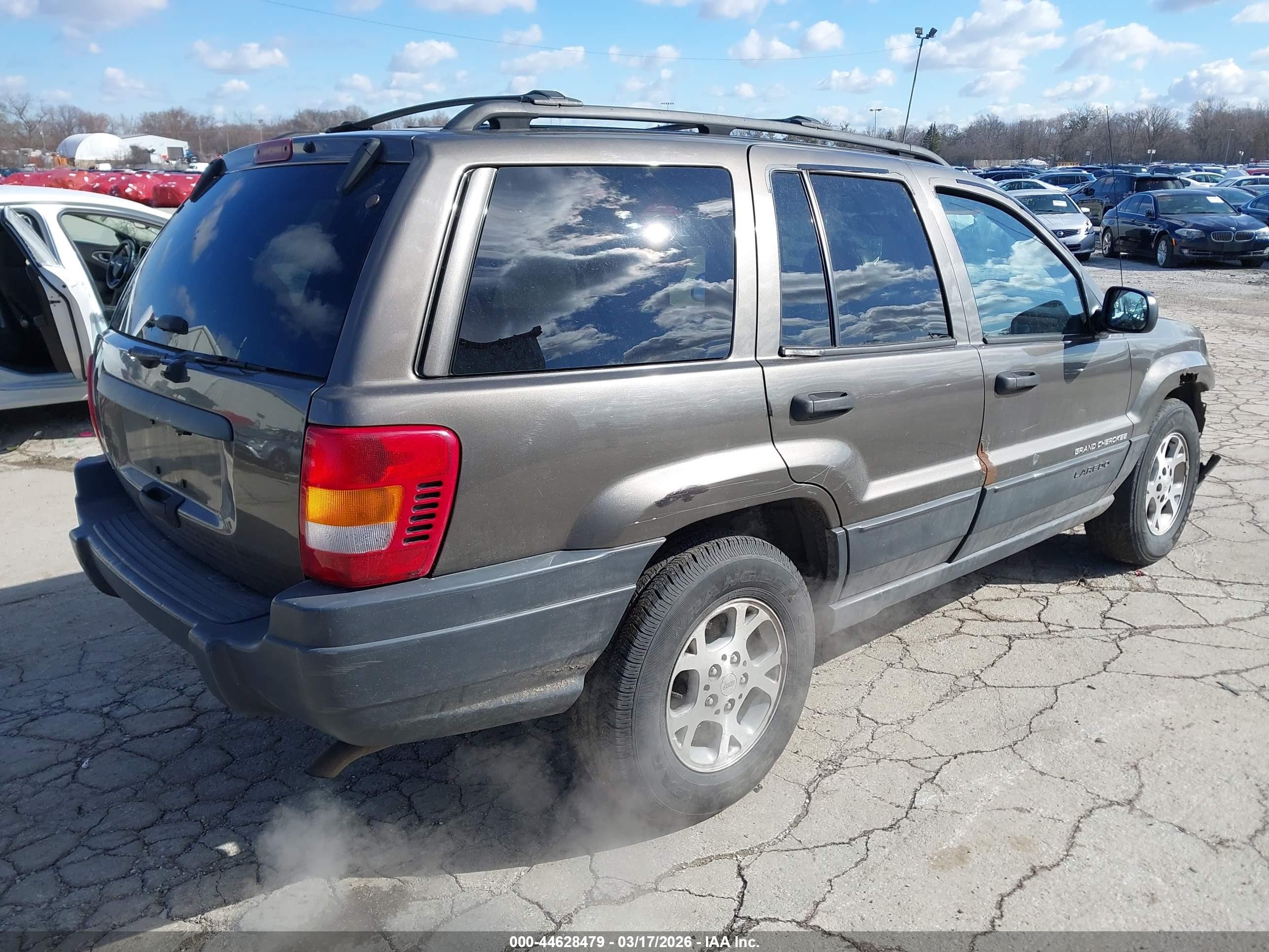 1999 Jeep Grand Cherokee Laredo Серый vin: 1J4GW58SXXC609972