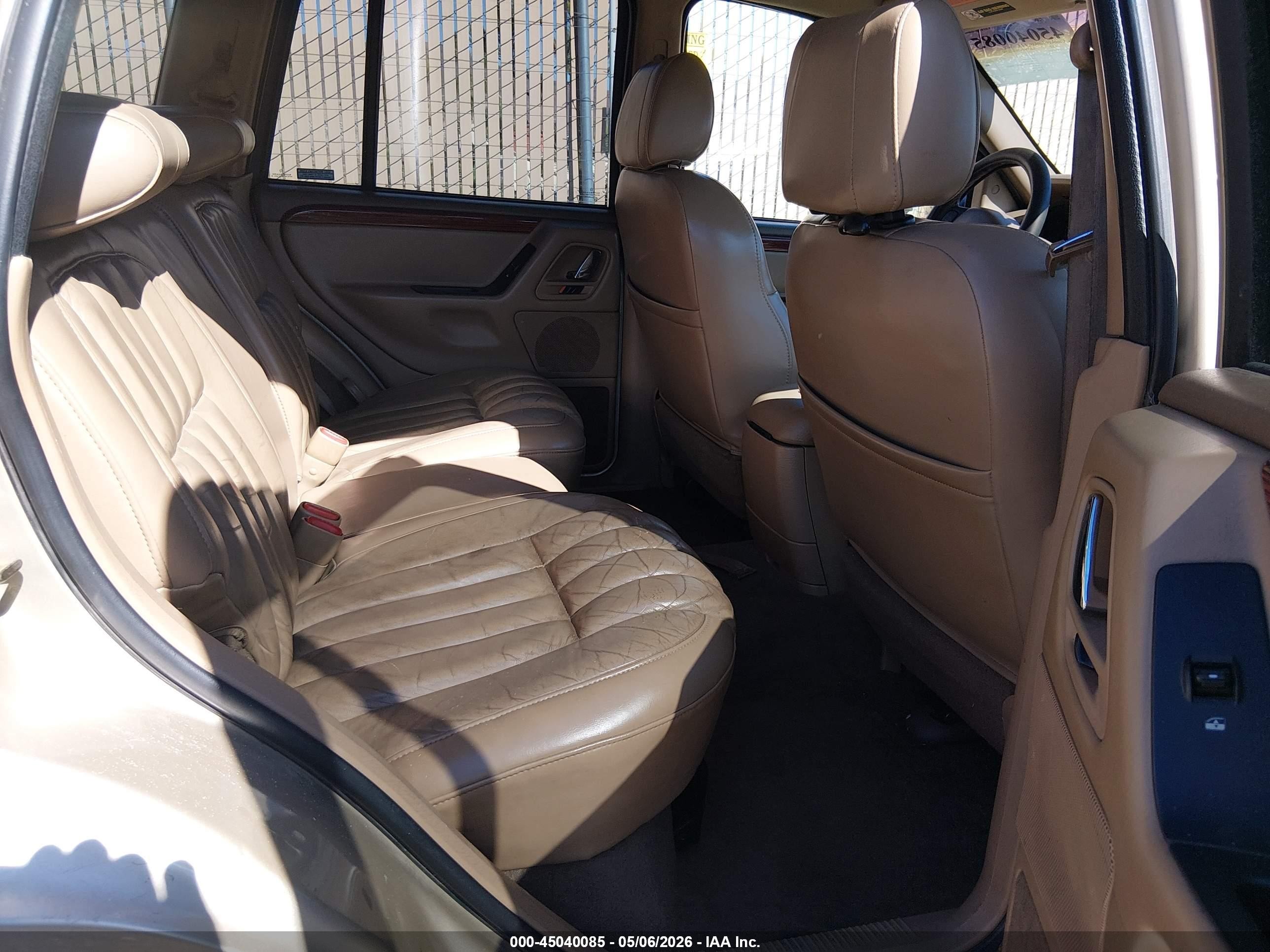 1999 Jeep Grand Cherokee Limited Золотой vin: 1J4GW68N7XC799214