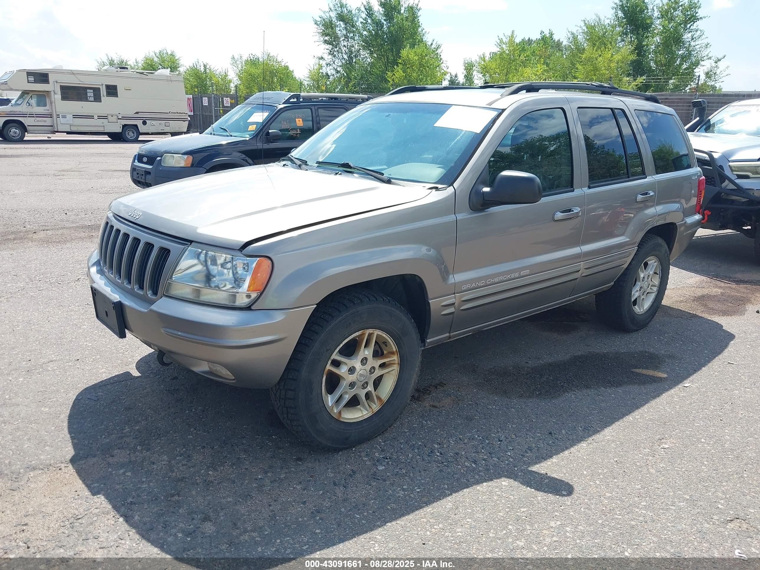 1999 Jeep Grand Cherokee Limited Серебряный vin: 1J4GW68N9XC803005