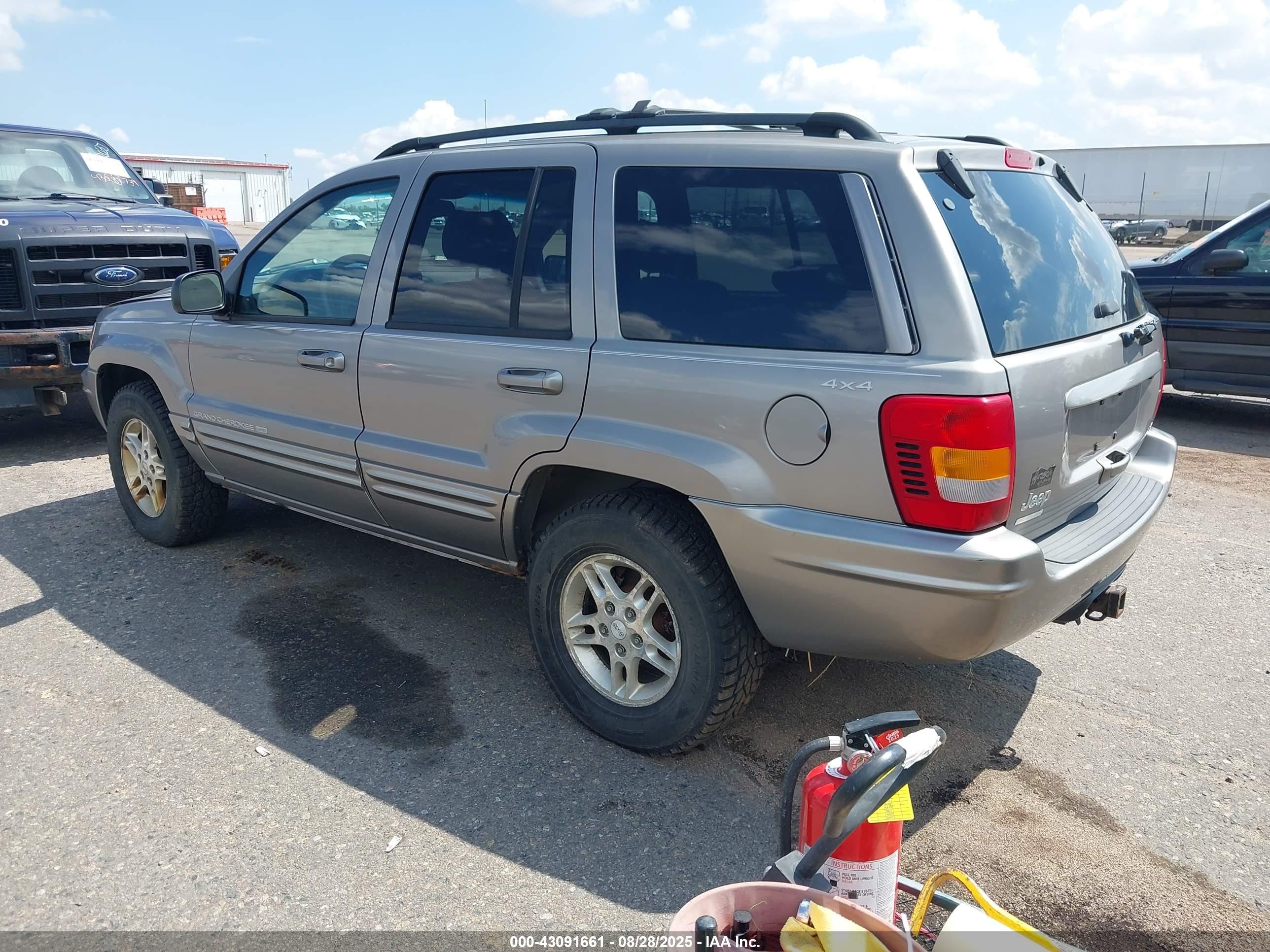 1999 Jeep Grand Cherokee Limited Серебряный vin: 1J4GW68N9XC803005