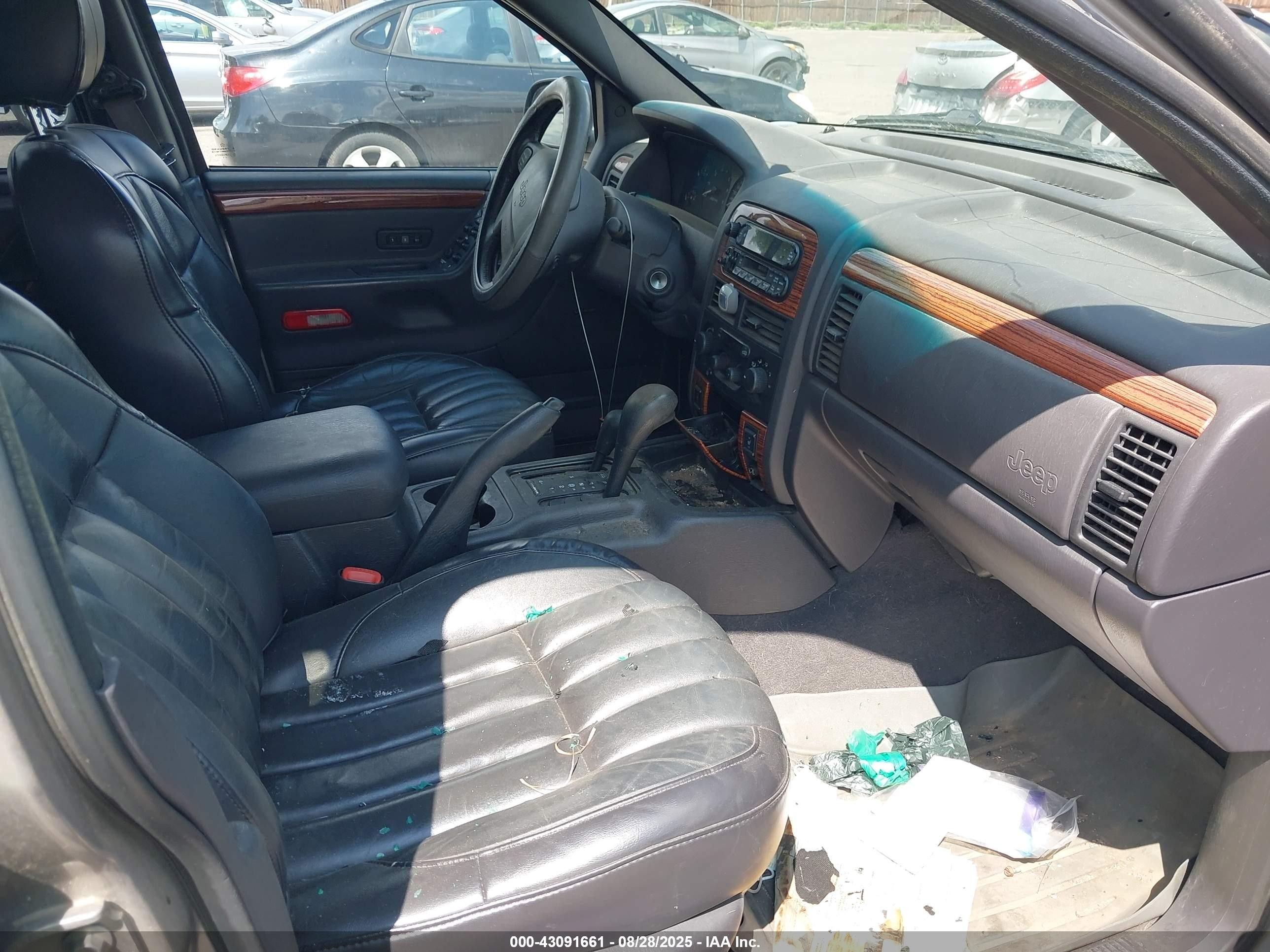 1999 Jeep Grand Cherokee Limited Серебряный vin: 1J4GW68N9XC803005
