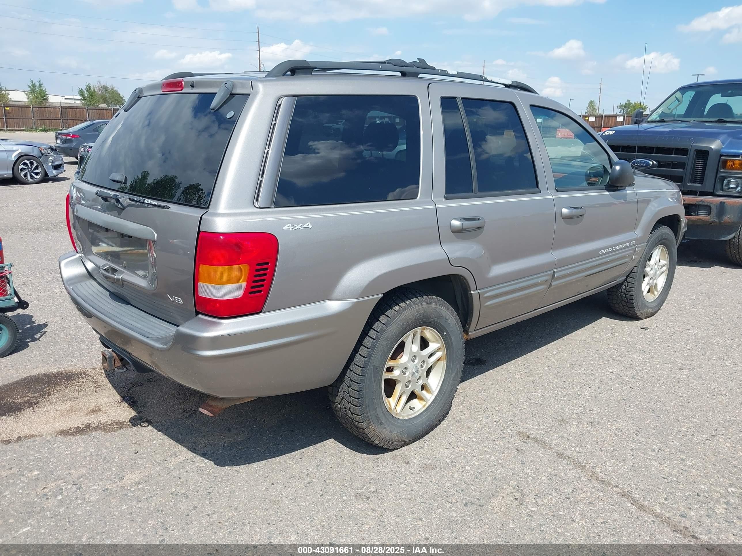 1999 Jeep Grand Cherokee Limited Серебряный vin: 1J4GW68N9XC803005