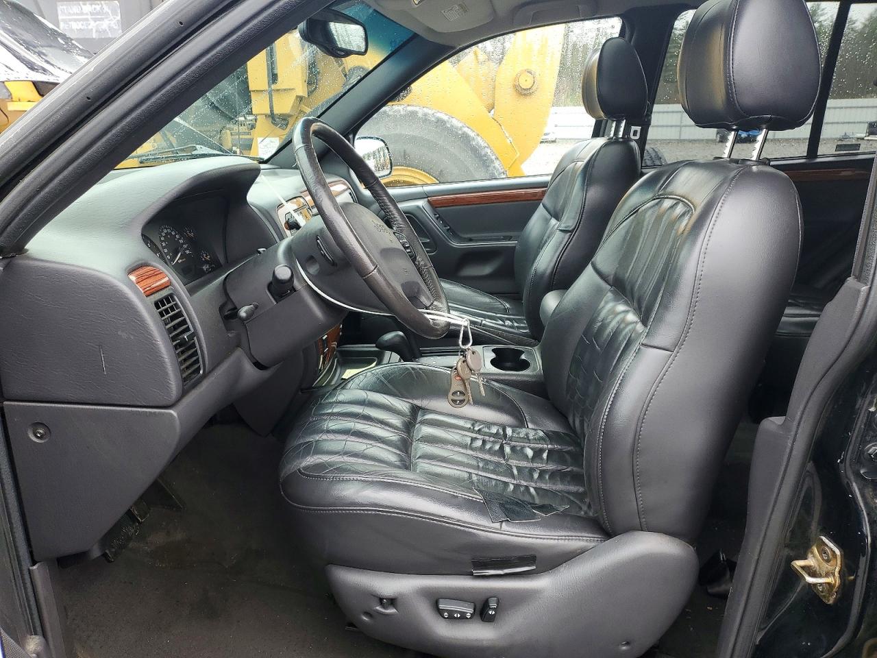 1999 Jeep Grand Cherokee Limited Черный vin: 1J4GW68S3XC615263
