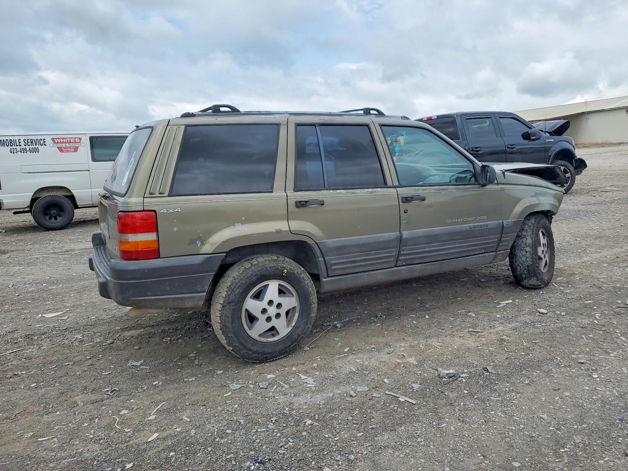 1997 Jeep Grand Cherokee Cream vin: 1J4GZ58Y1VC709046