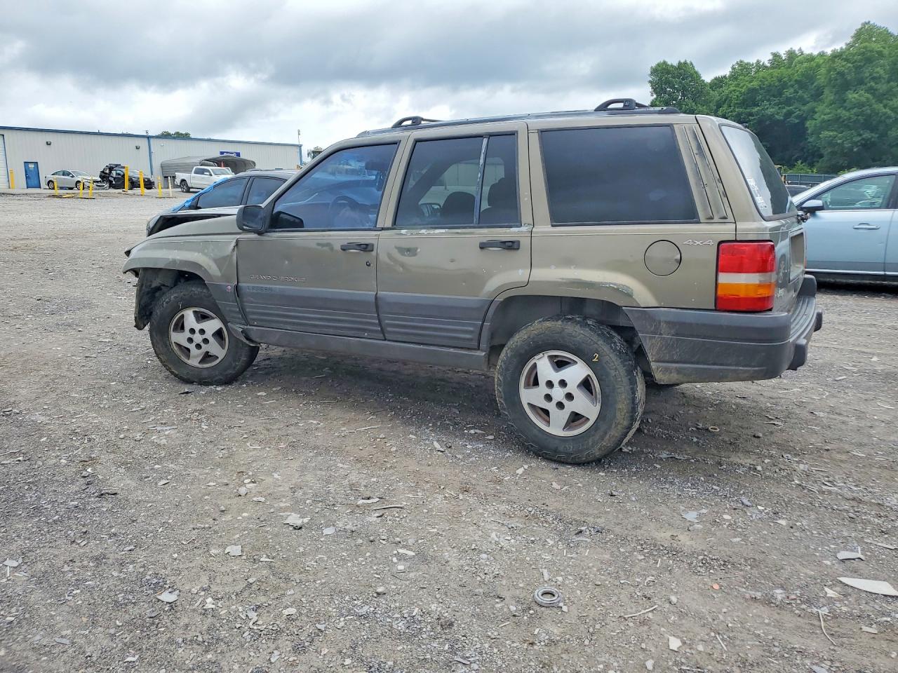 1997 Jeep Grand Cherokee Cream vin: 1J4GZ58Y1VC709046