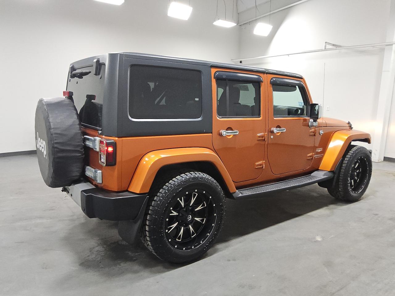 2011 Jeep Wrangler Unlimited Sahara Orange vin: 1J4HA5H11BL542536 Damage: Right Qtr Panel, Heavy Scratch, 1 To 2 Inches