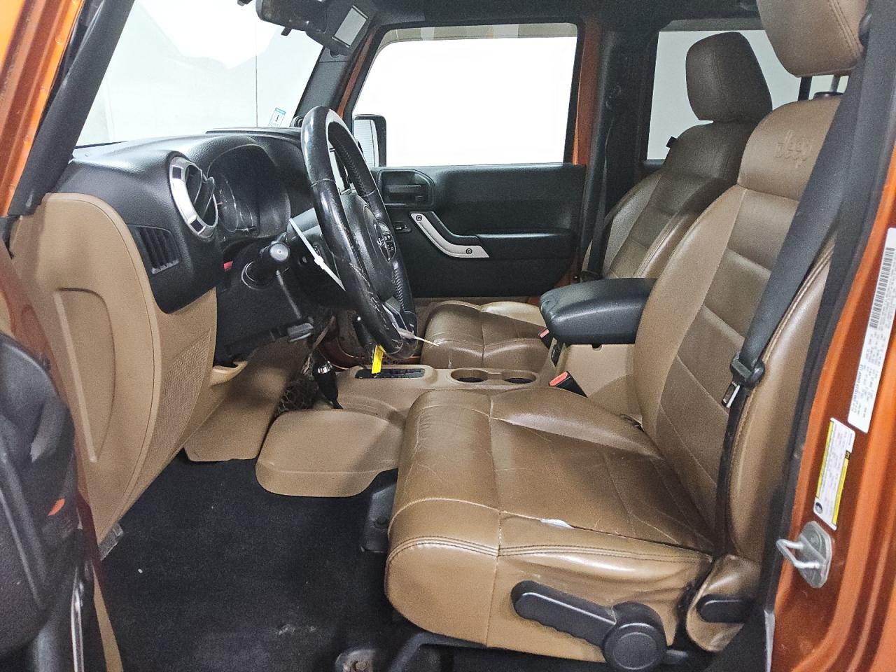 2011 Jeep Wrangler Unlimited Sahara Orange vin: 1J4HA5H11BL542536 Damage: Left Front Seat Cushion, Cut, 2 To 3 Inches