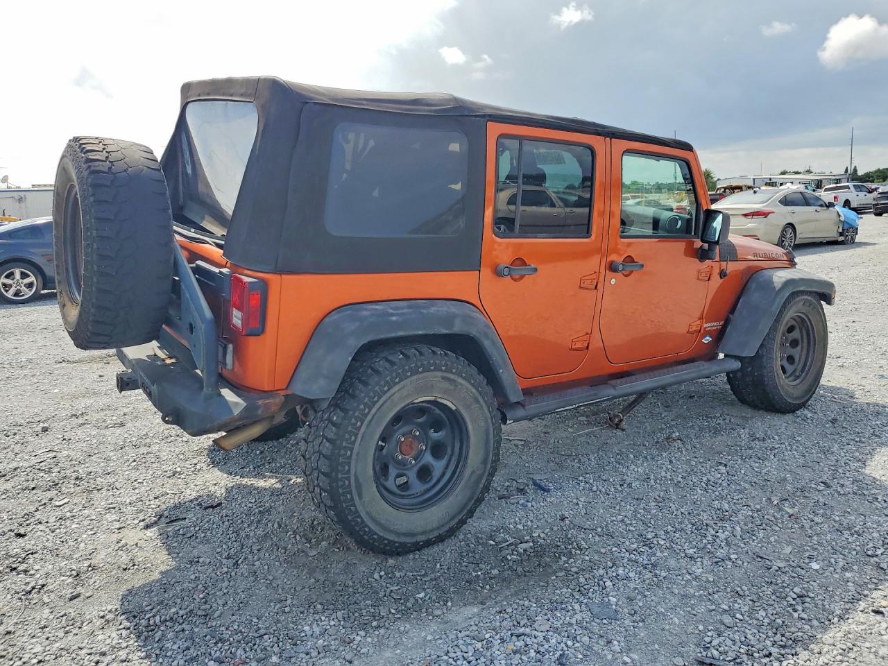 2011 Jeep Wrangler Unlimited Rubicon Orange vin: 1J4HA6H1XBL638459