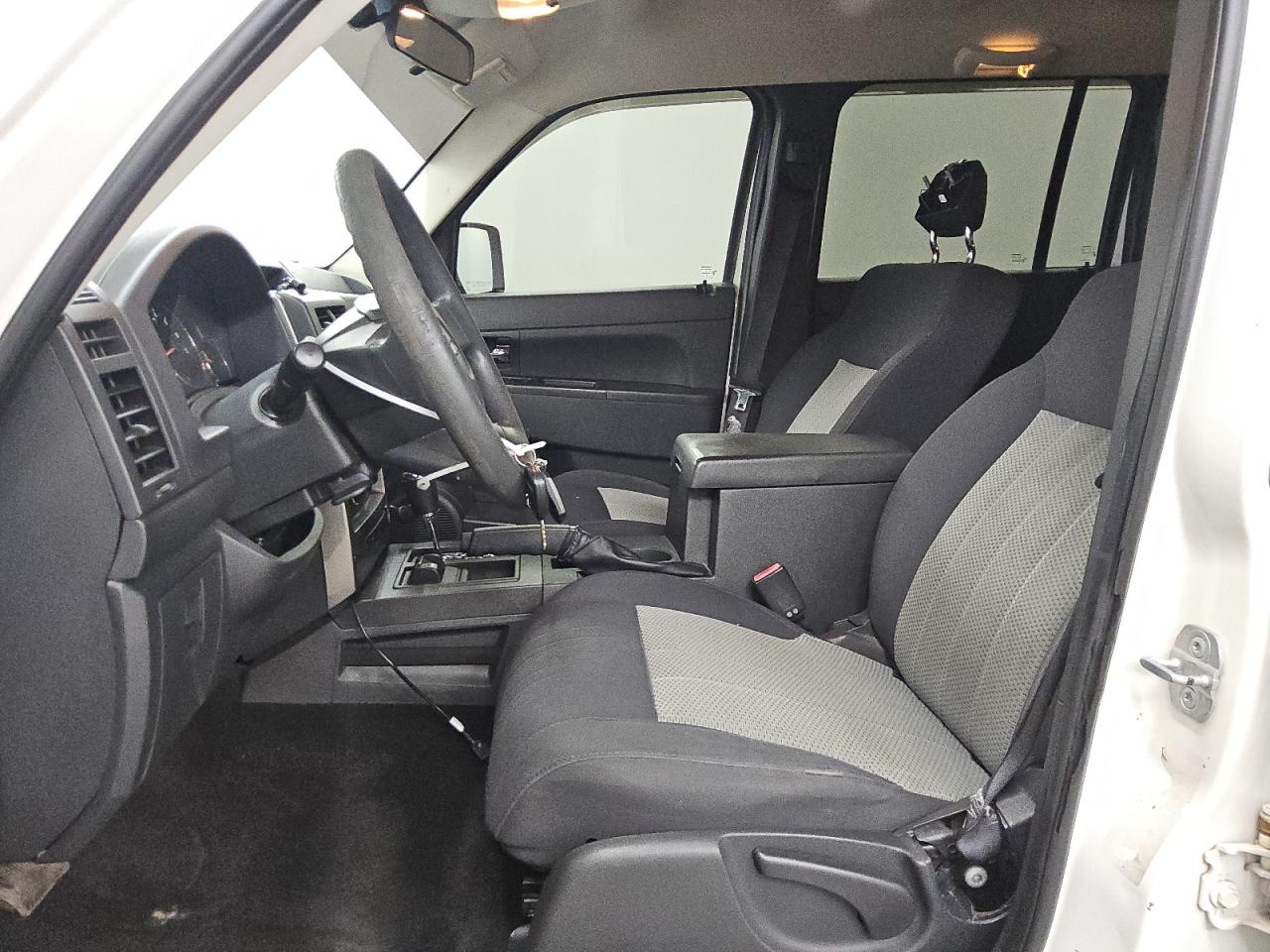 2010 Jeep Liberty Sport White vin: 1J4PN2GK3AW110438 Damage: Left Front Carpet, Worn, Replacement Required