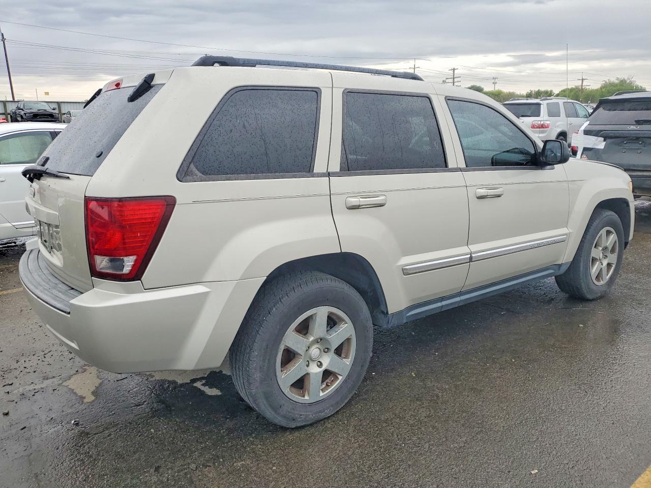 2010 Jeep Grand Cherokee Laredo Желто-коричневый vin: 1J4PR4GKXAC130753